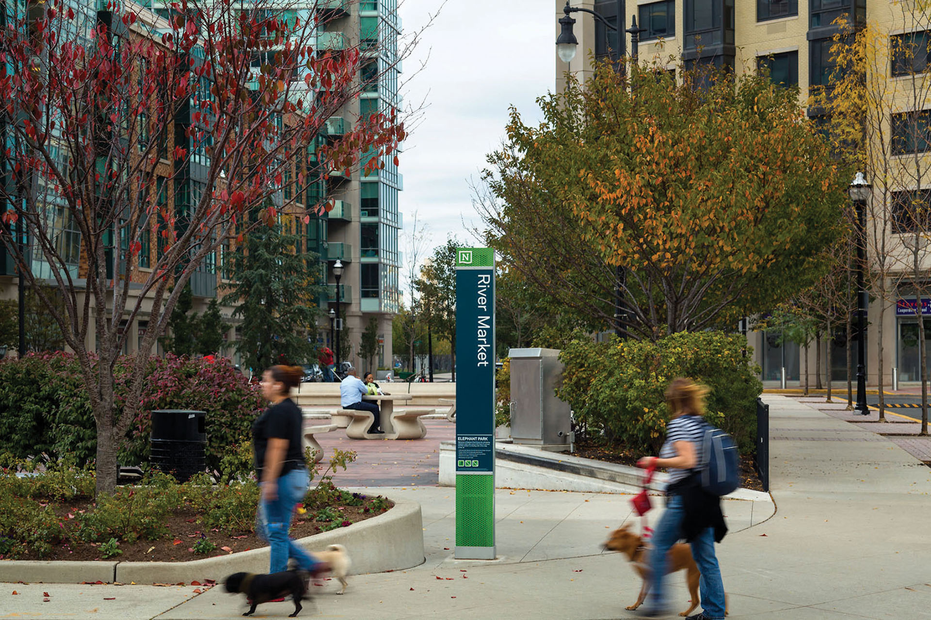 Community of Newport exterior post-mounted pedestrian identification sign for River Market with rules and accessible map, designed by Two Twelve