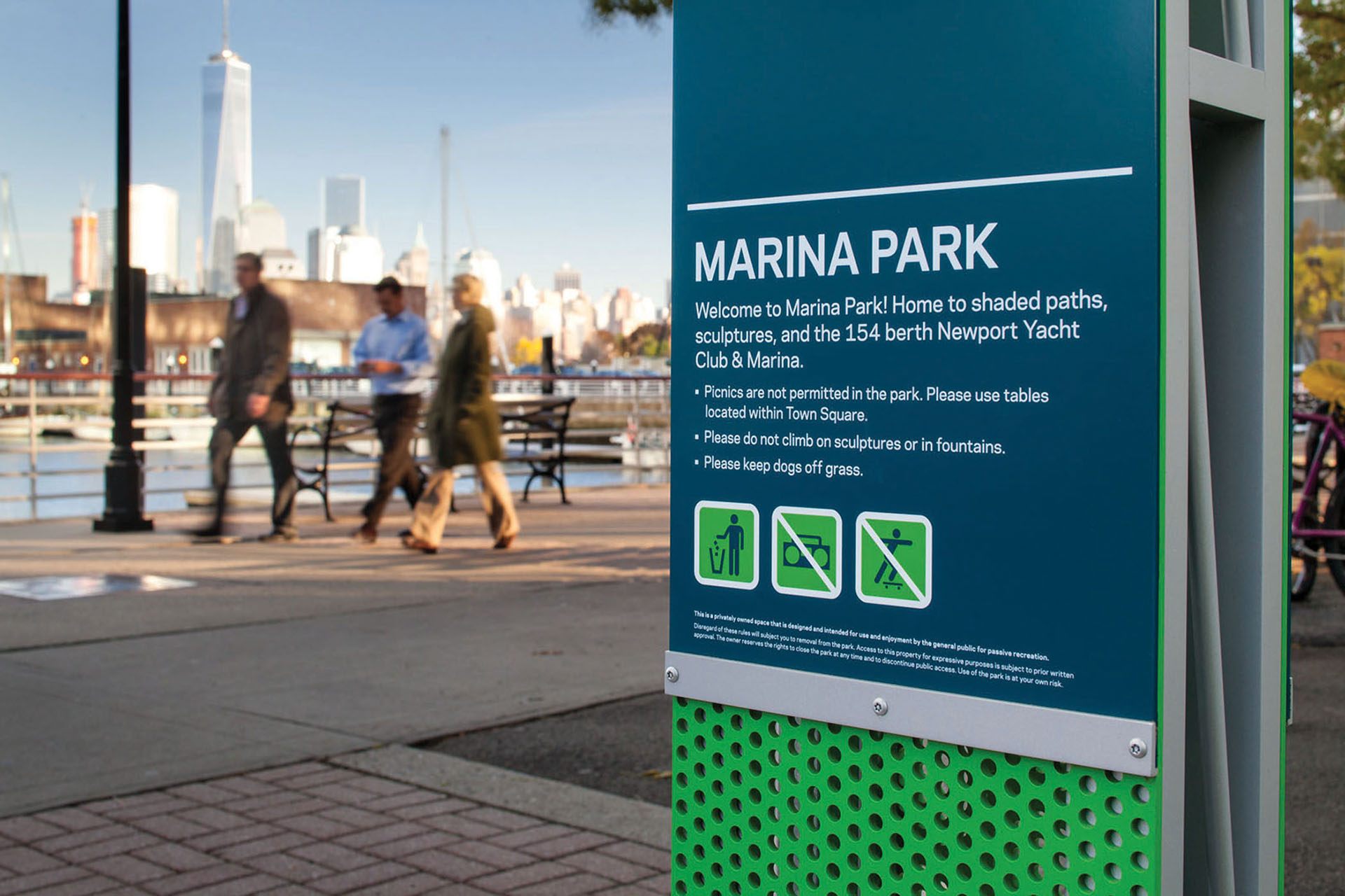 Community of Newport exterior post-mounted pedestrian identification sign for Marina Park with rules and icons, designed by Two Twelve