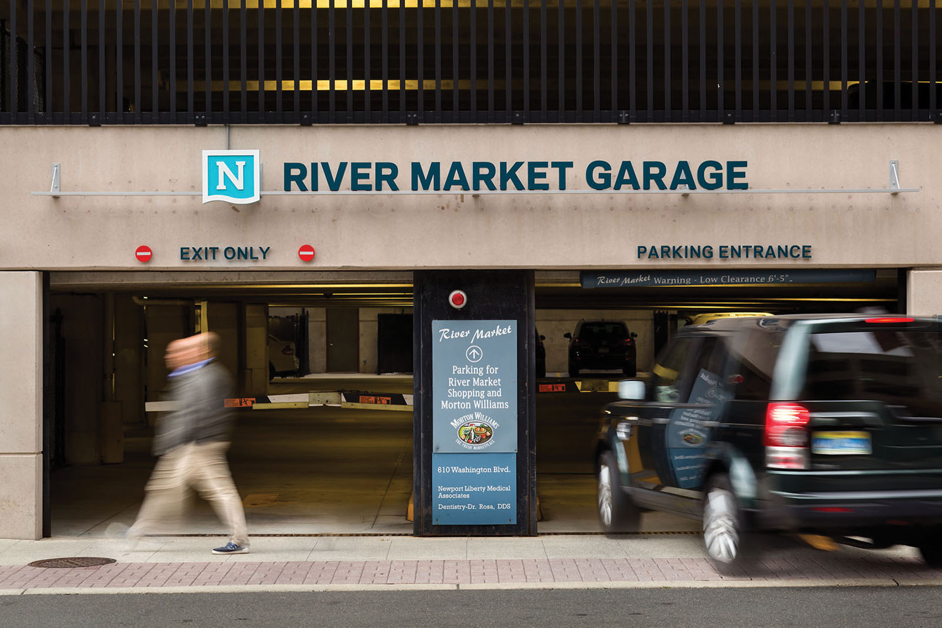 Community of Newport exterior wall-mounted identification sign for River Market Garage above vehicular entrance, designed by Two Twelve