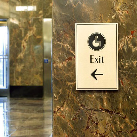 Empire State Building small interior wall-mounted directional sign for handicap exit, designed by Two Twelve