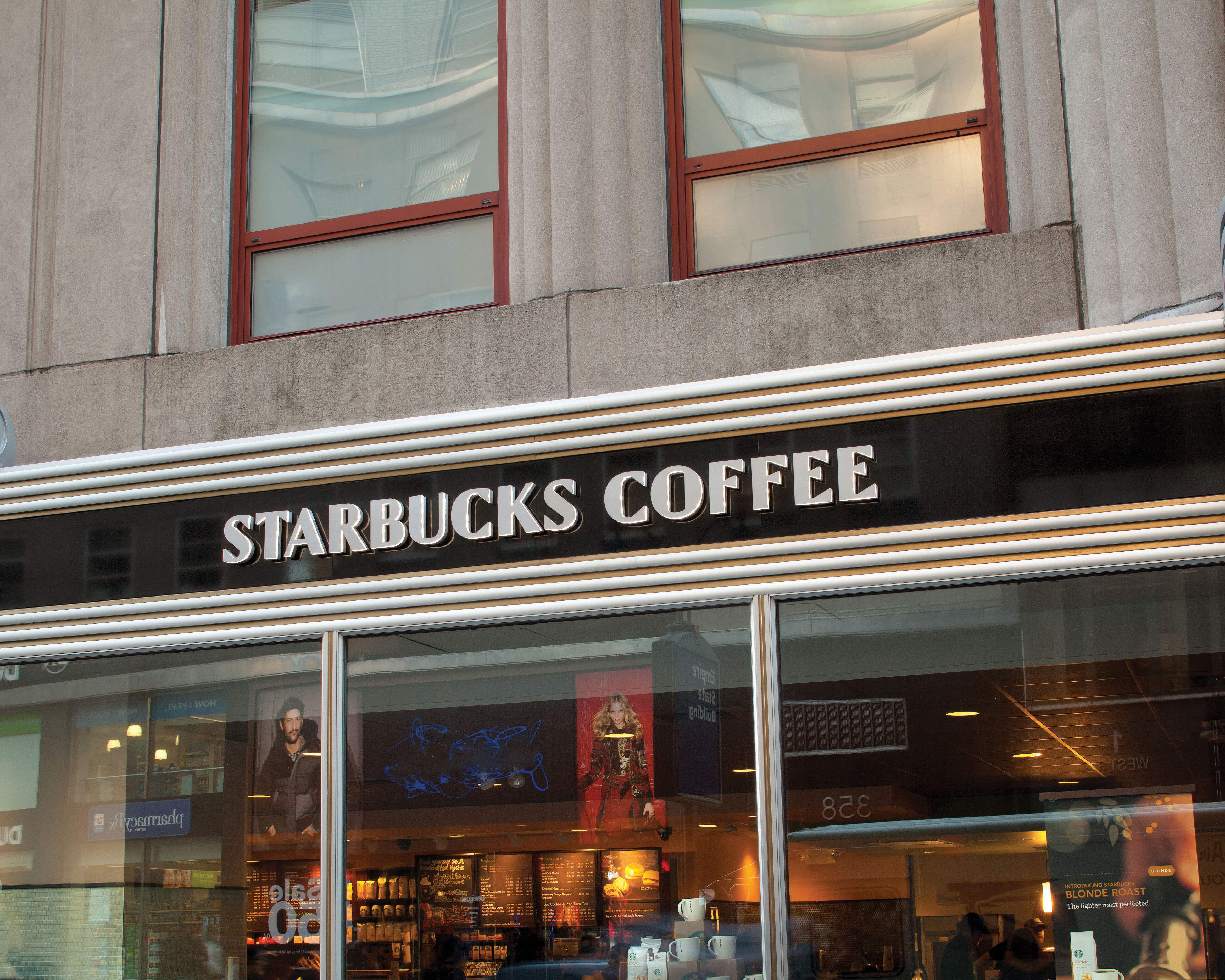 Empire State Building exterior retail standards for Starbucks with dimensional illuminated lettering, designed by Two Twelve