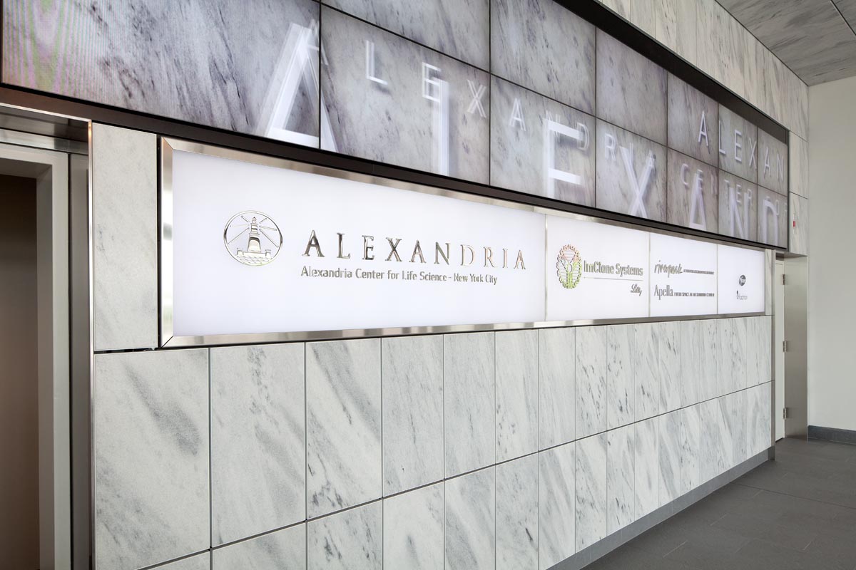 Alexandria Center for Life Sciences interior lobby tenant signage with digital displays, designed by Two Twelve