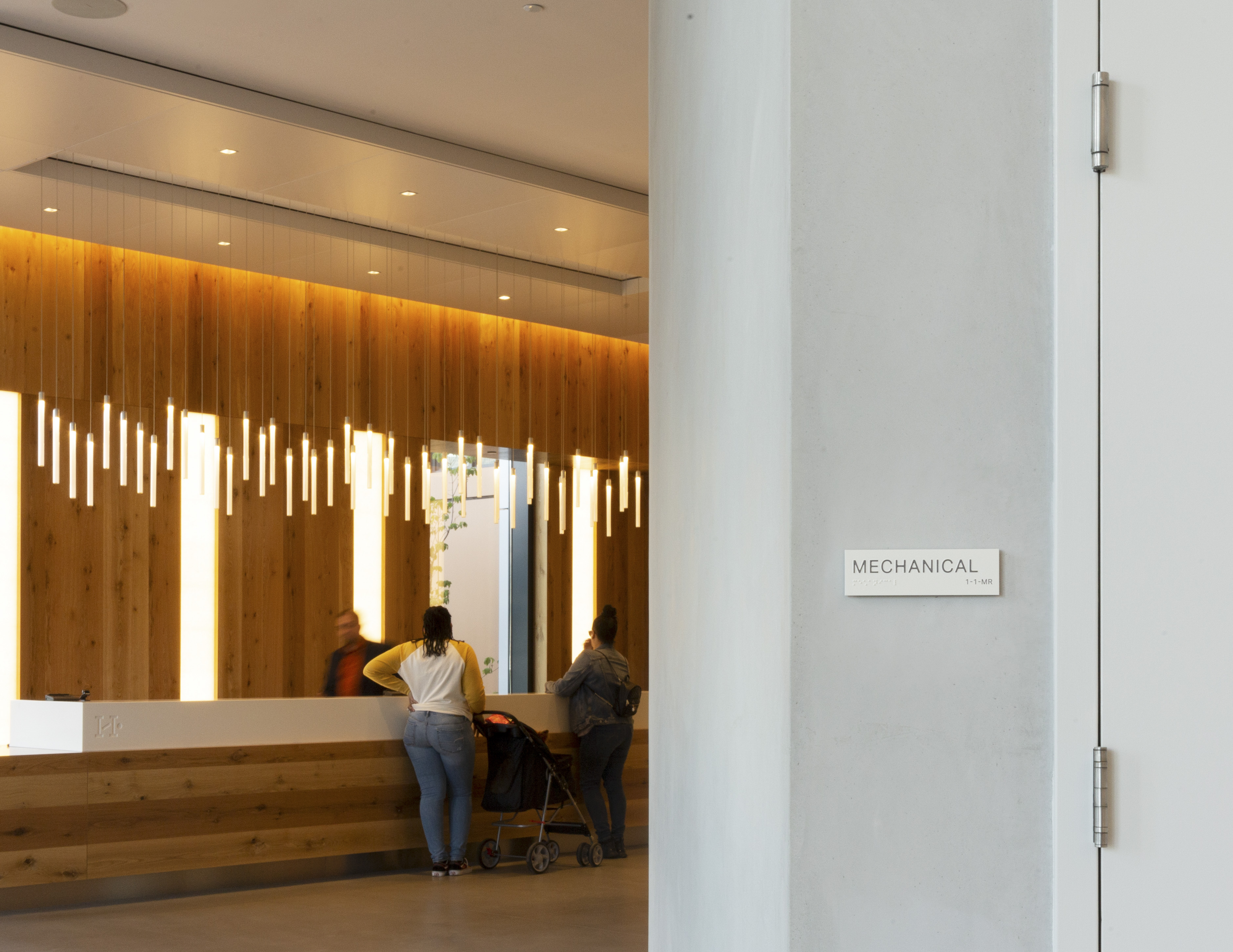Halletts Point main reception desk and back-of-house mechanical room identification signage, designed by Two Twelve