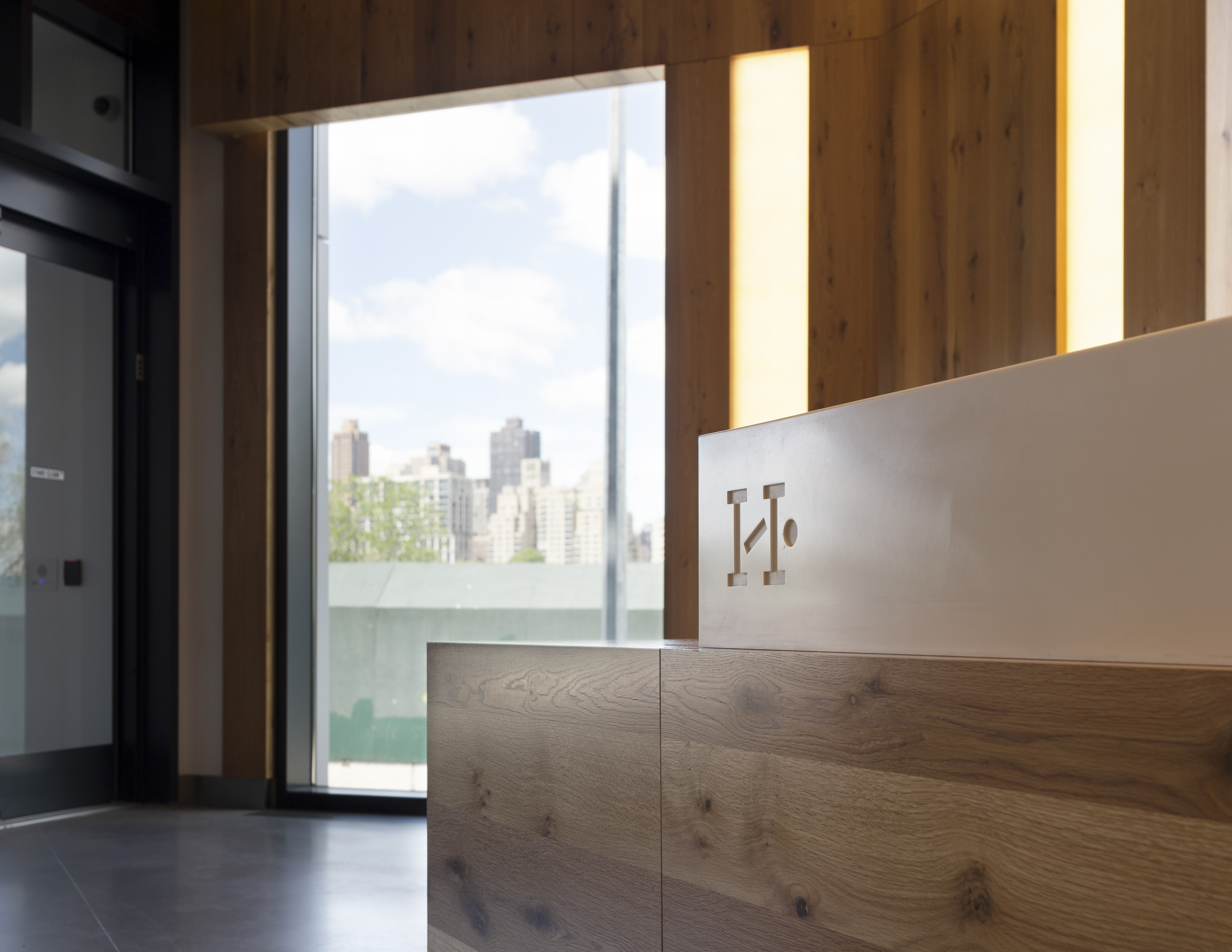 Halletts Point interior main reception desk branding detail, designed by Two Twelve