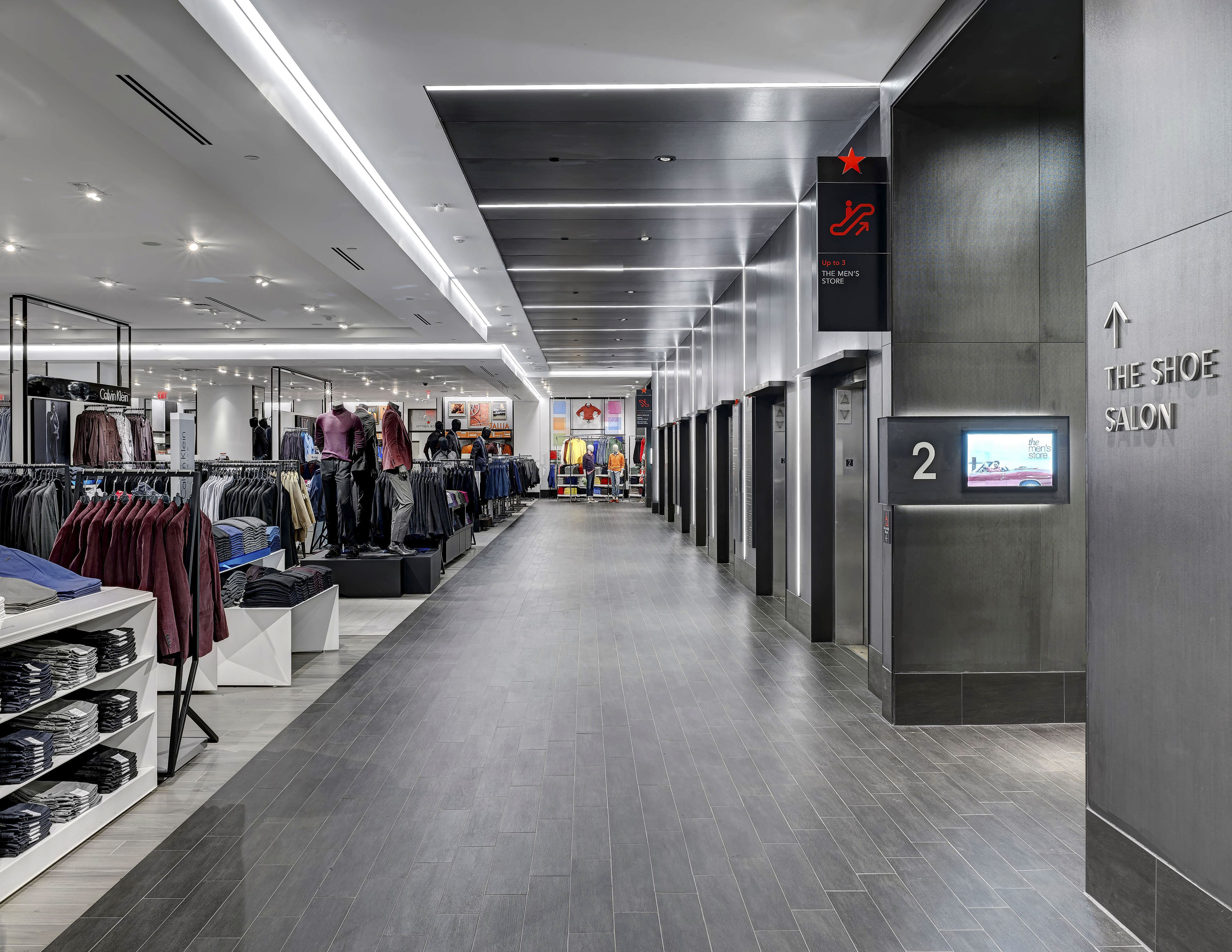 Macy's Herald Square interior elevator identification and directional signage with integrated digital display, designed by Two Twelve