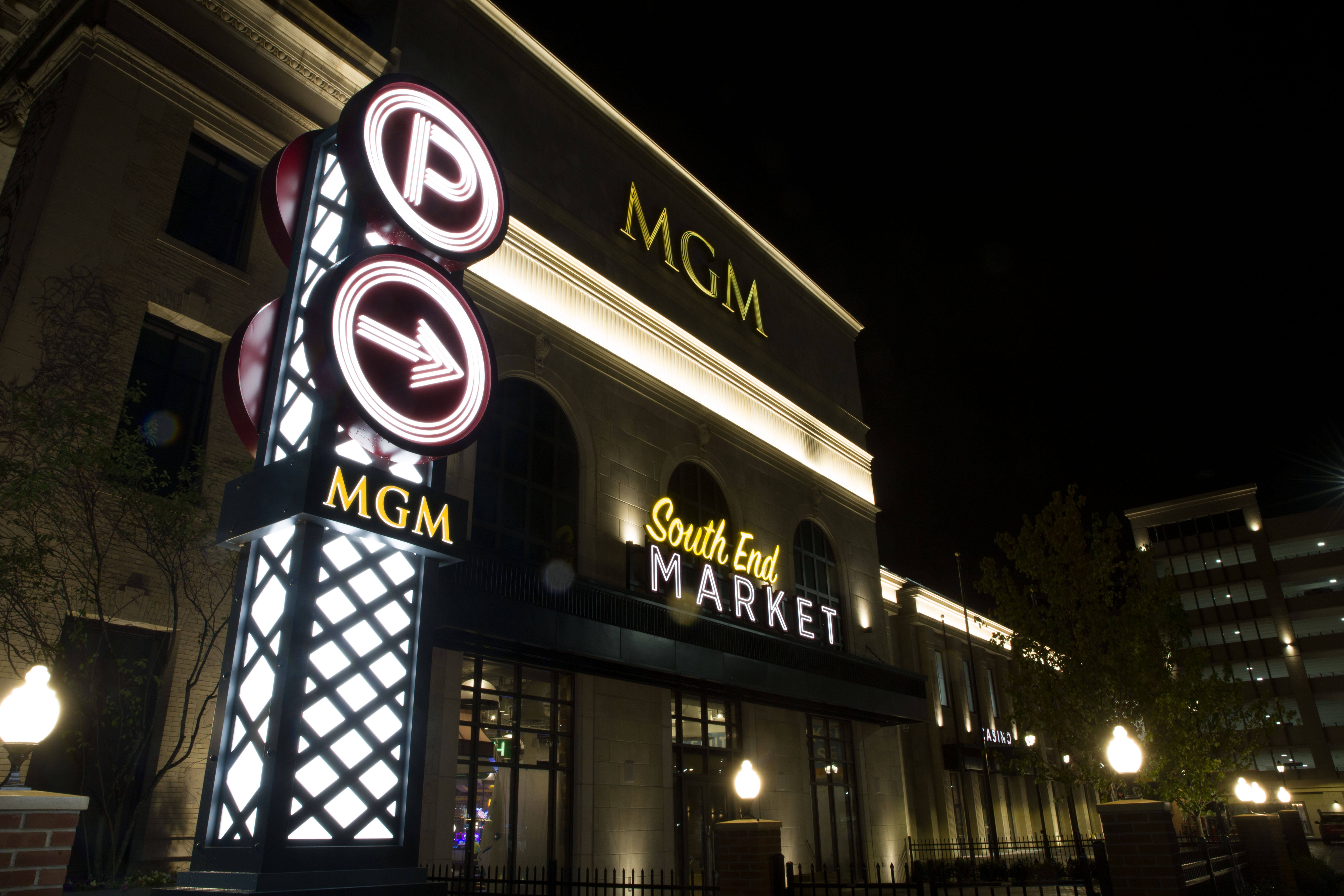 MGM Springfield building signage with parking signage and South End Market illuminated signs, designed by Two Twelve