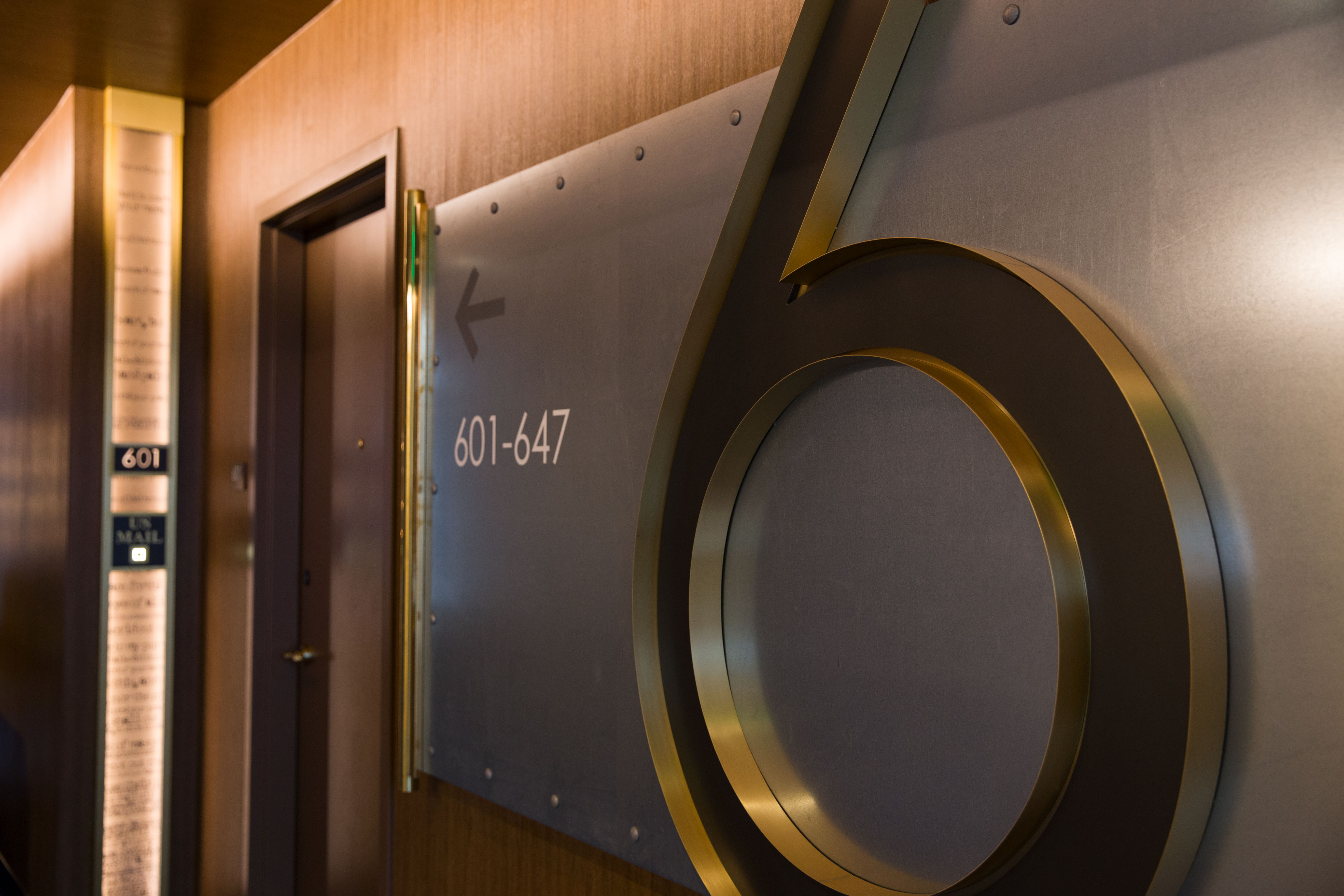 MGM Springfield floor identification and directional signage on brushed stainless steel, designed by Two Twelve