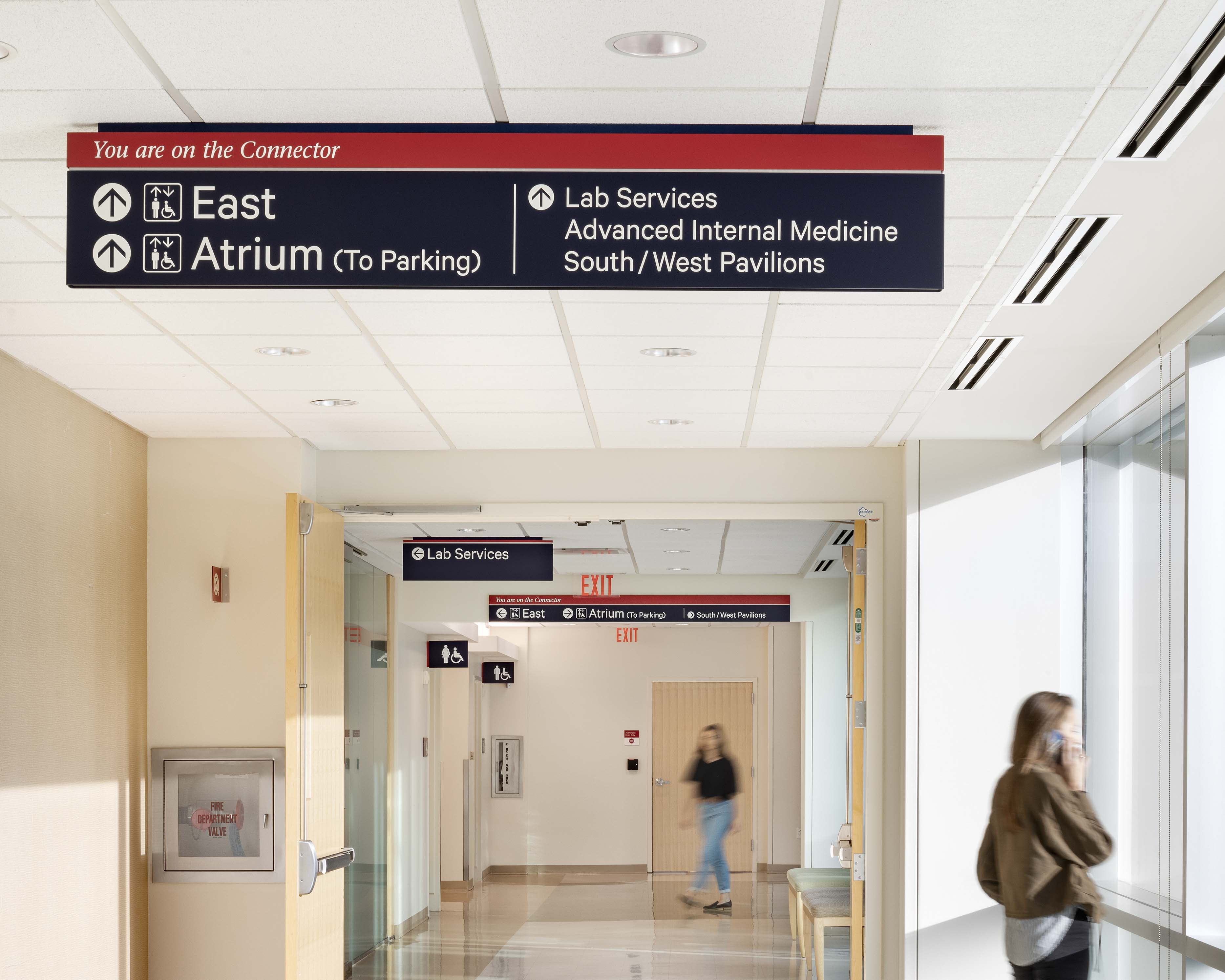 Penn Medicine overhead directional signage with connector identification, designed by Two Twelve