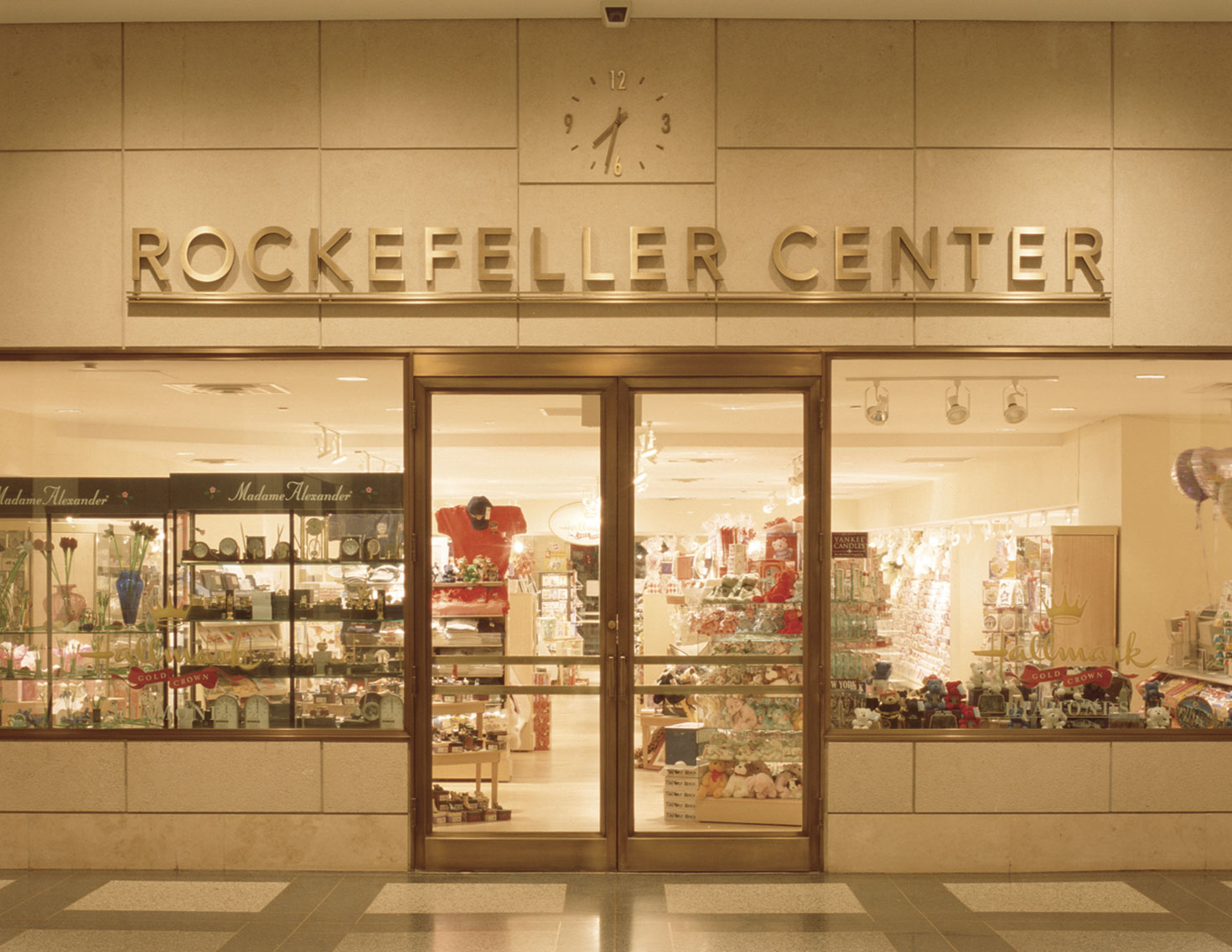 Rockefeller Center Retail Concourse gift shop identification with pinned lettering on stainless steel, designed by Two Twelve