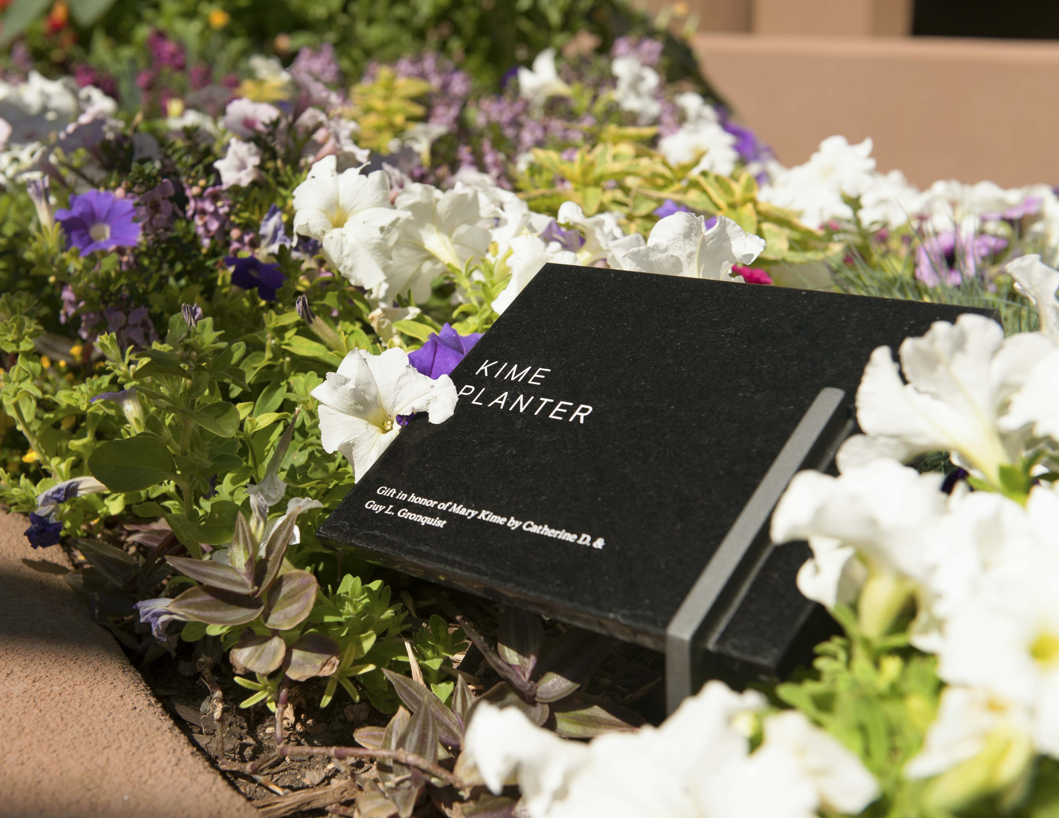 The Santa Fe Opera planter-mounted donor sign in marble and stainless steel, designed by Two Twelve