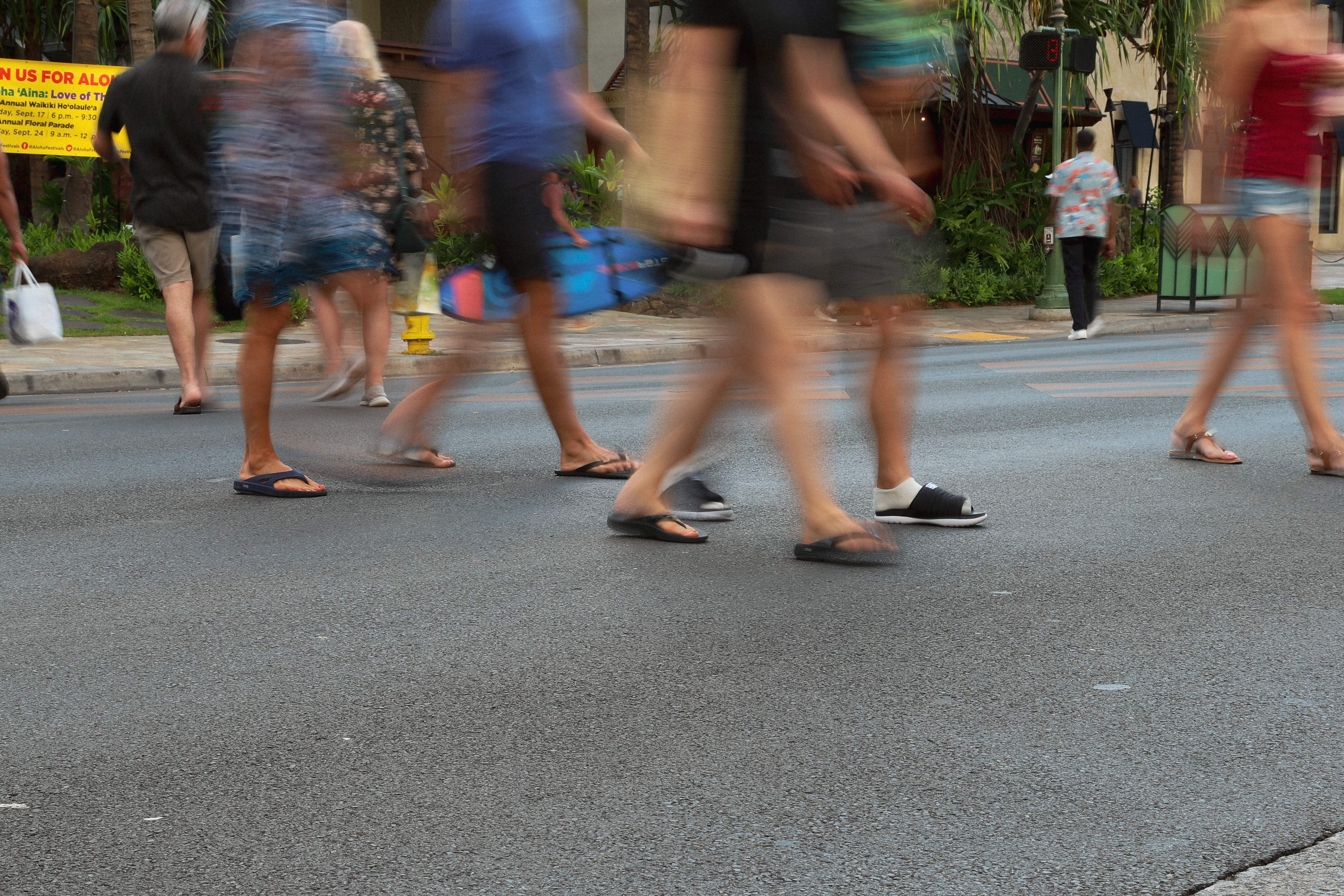 Waikiki wayfinding signage people walking on street, designed by Two Twelve