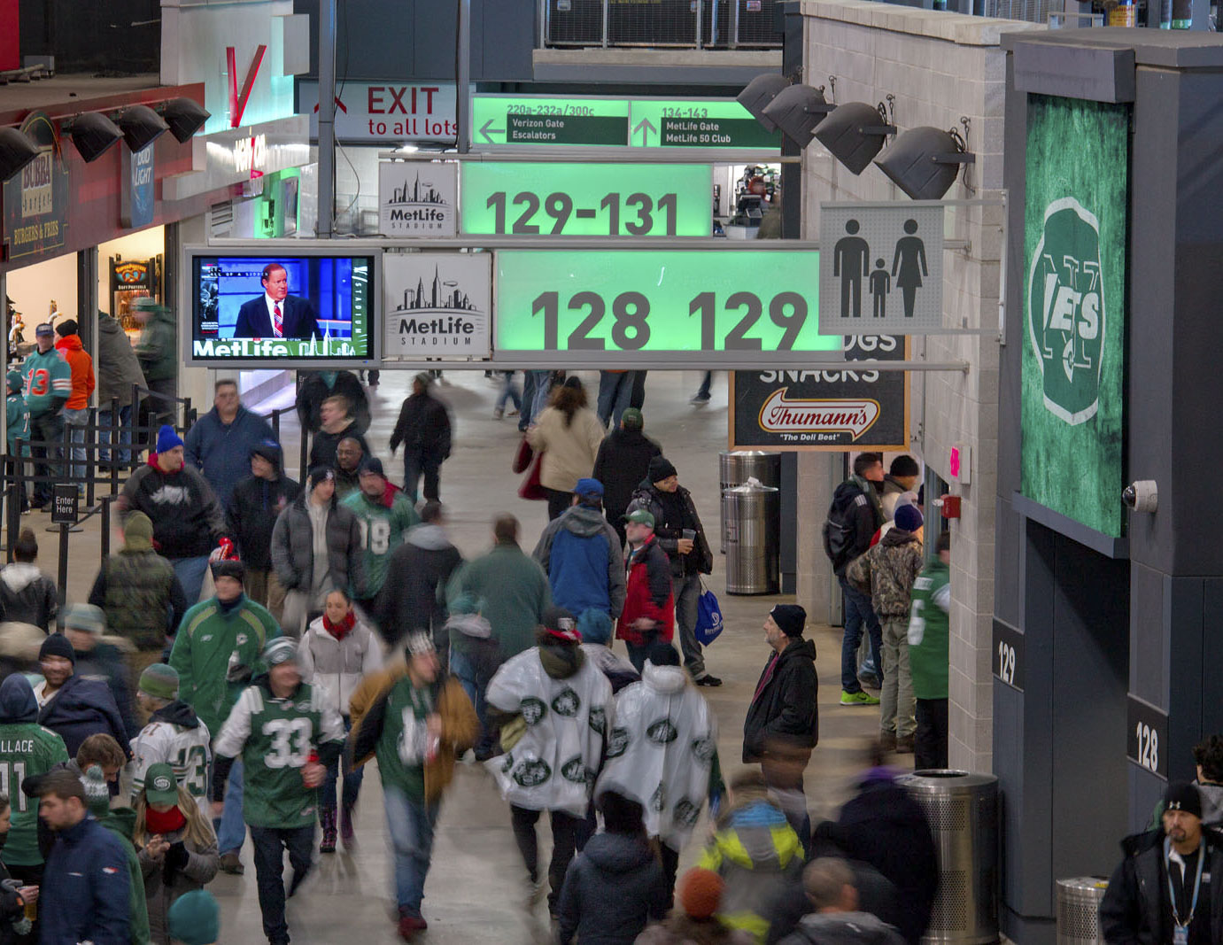 MetLife Stadium LED seating section numbers and directional signs in Jets green, designed by Two Twelve