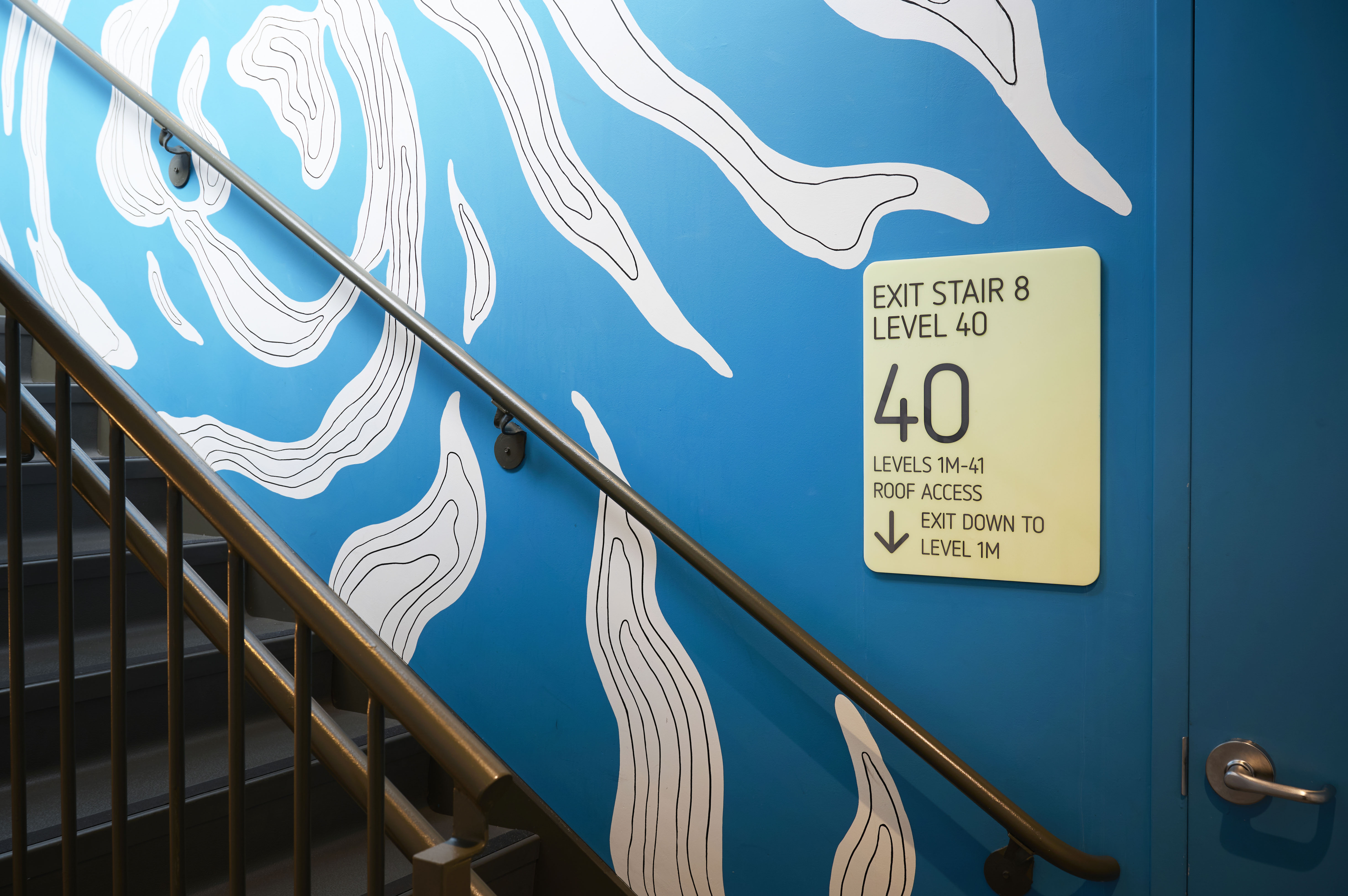 Ward Village interior stair fire evacuation signage, designed by Two Twelve