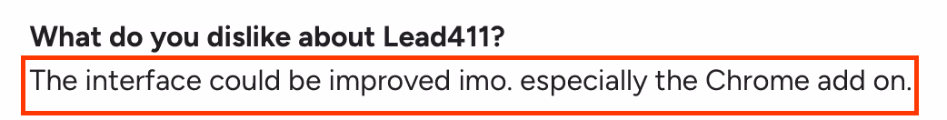 Screenshot of a G2 review section where a user mentions their dislike about Lead411, stating that the interface could be improved, especially the Chrome add-on.