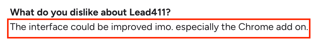 Screenshot of a G2 review section where a user mentions their dislike about Lead411, stating that the interface could be improved, especially the Chrome add-on.