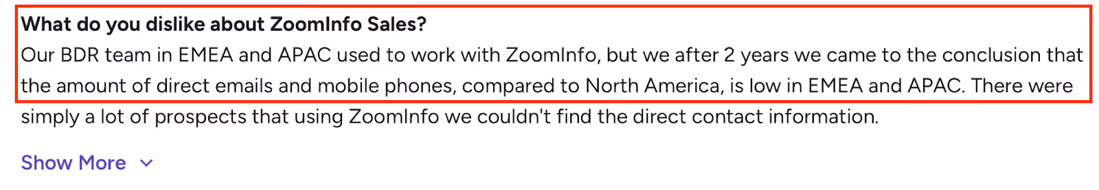A User review highlighting limited direct email and phone data for EMEA and APAC regions in ZoomInfo Sales.