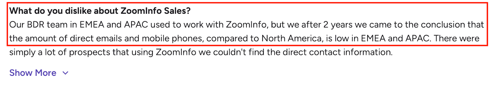A User review highlighting limited direct email and phone data for EMEA and APAC regions in ZoomInfo Sales.
