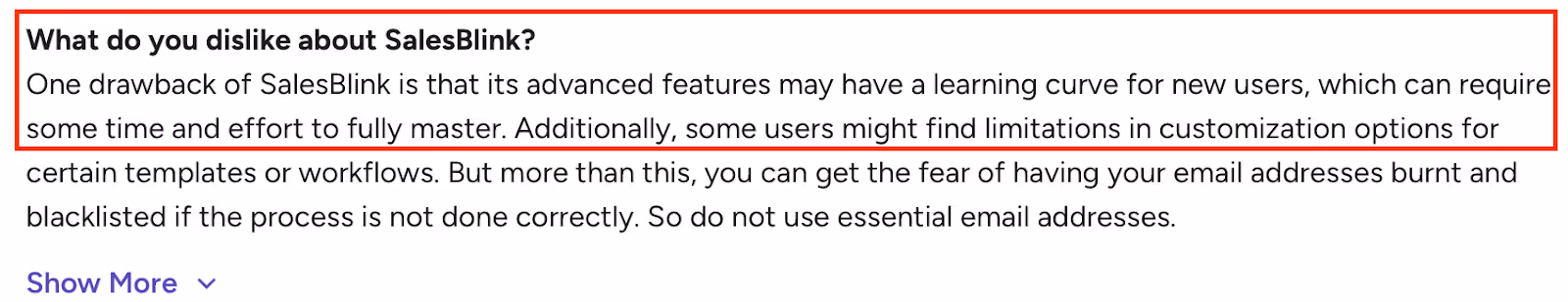 Screenshot of a review noting SalesBlink’s learning curve, limited customization, and email-risk concerns