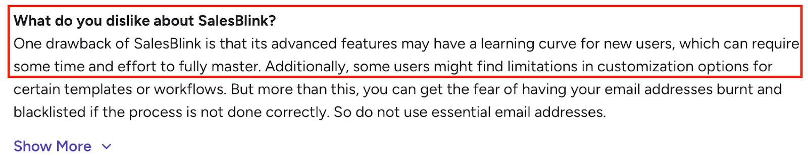 Screenshot of a review noting SalesBlink’s learning curve, limited customization, and email-risk concerns