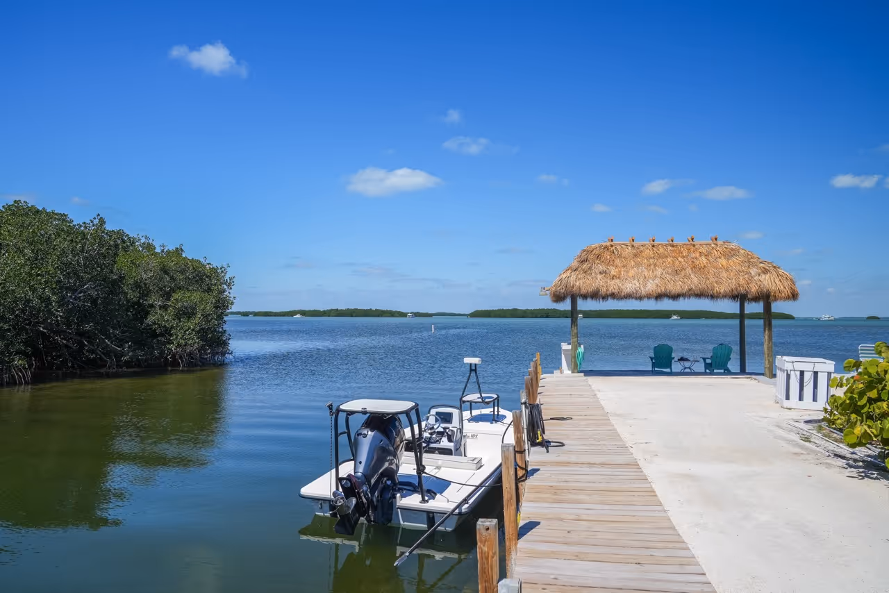 Kon Tiki Resort tiki hut and flats boat docked at the ramp on the Florida Bay.