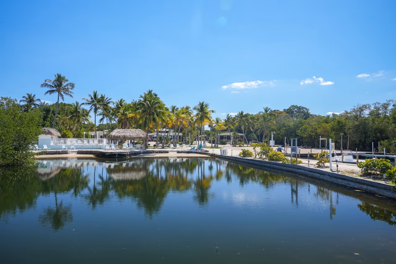 View of the Kon Tiki Resort from the Florida Bay. Showing the tiki hut, marina, and boat ramp.