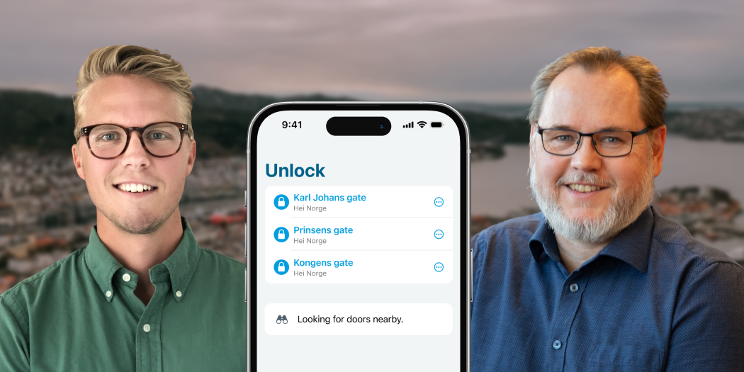Two men and a smartphone showing the Parakey app in the foreground. In the background is a view of Norway.