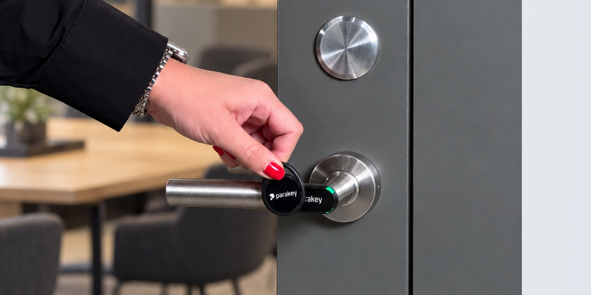 Parakey' fob , and access cards, as well as a person unlocking a Parakey Door Handle with a fob.