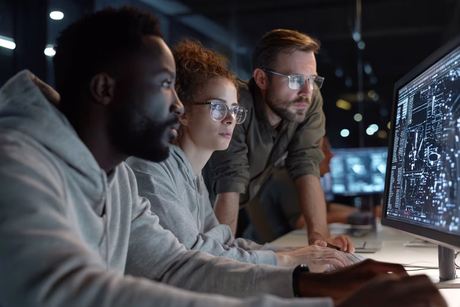 Diverse IT team analyzing security vulnerability data