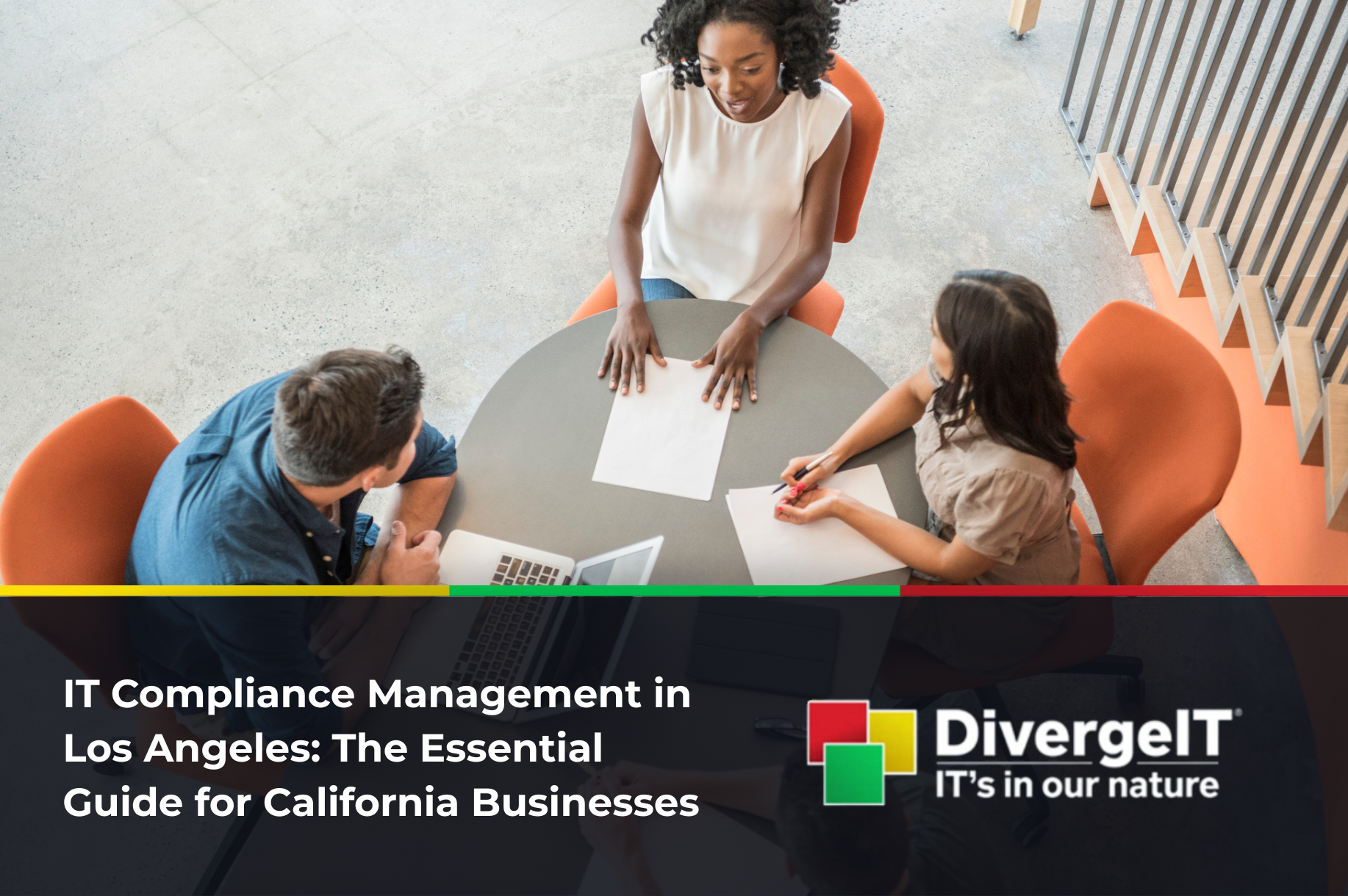 Business professionals reviewing IT compliance documents in Los Angeles office