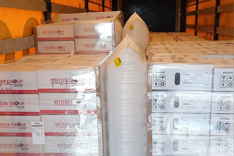 Pallets of Betzler Group Edge boxes loaded on a truck for delivery