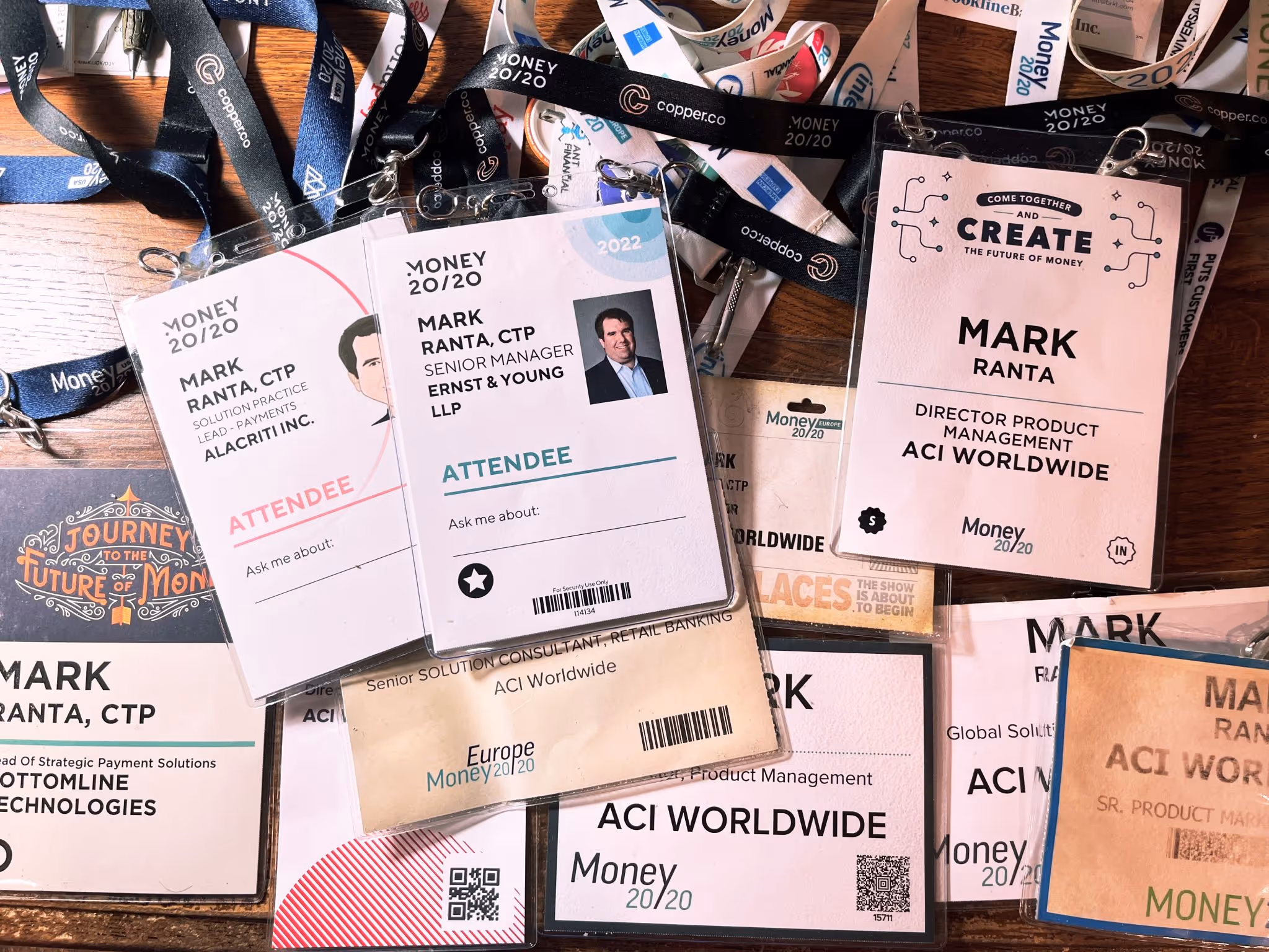 A collection of badges from Money20/20 conferences