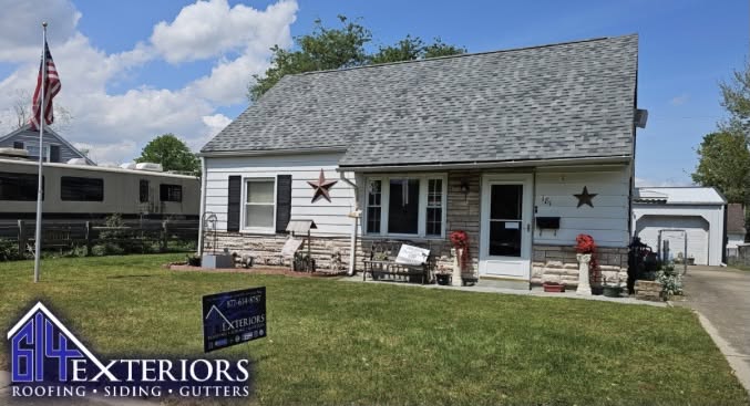 White vinyl siding home with gray shingle roof completed by 614 Exteriors in Columbus, Ohio