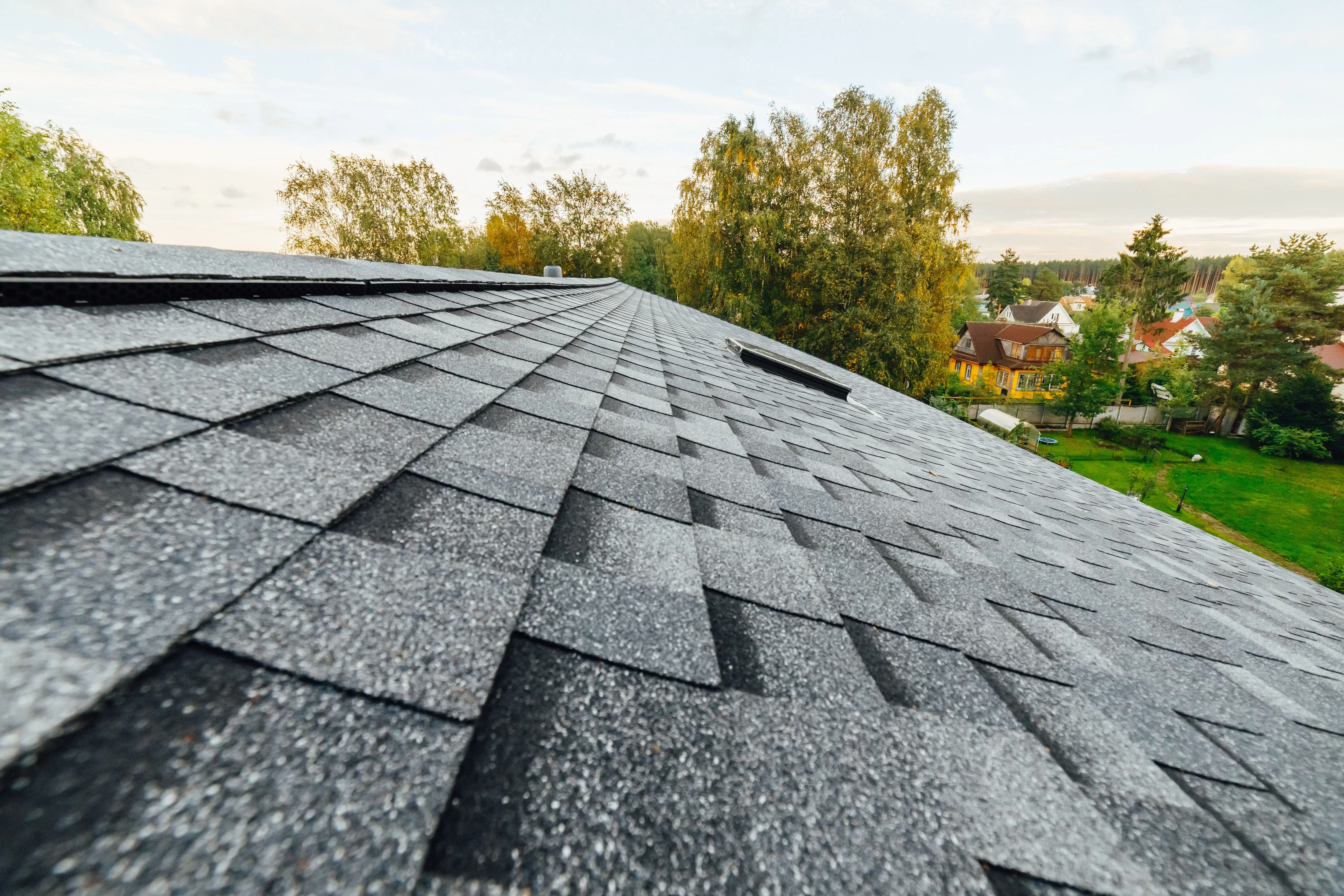 Close-up view of gray architectural roof shingles on a residential roof