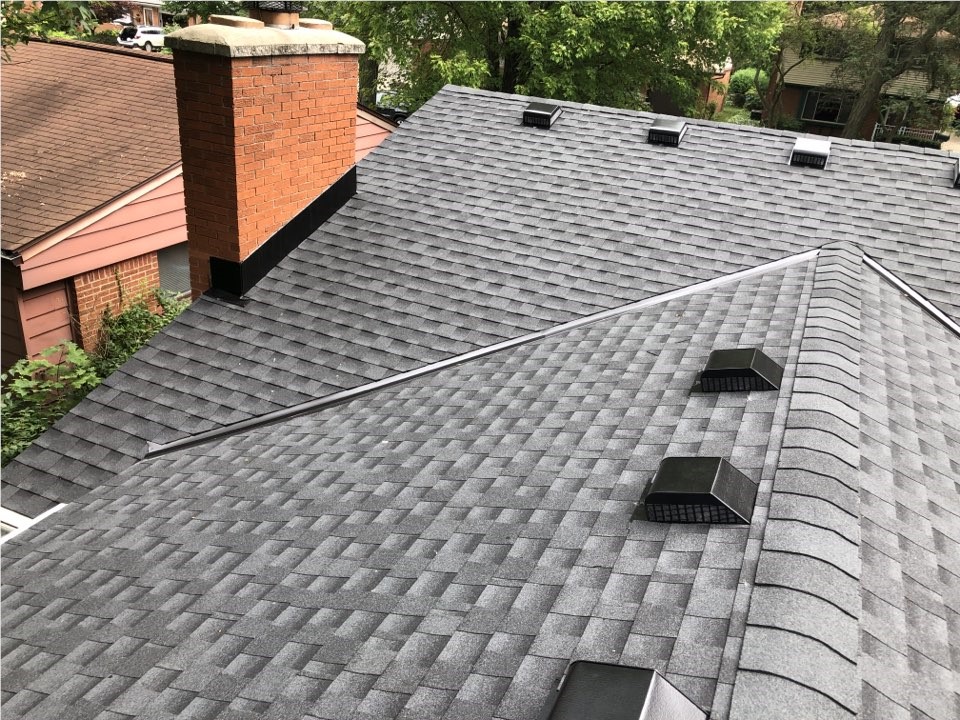 Asphalt shingle roof with multiple attic exhaust vents installed to improve roof ventilation
