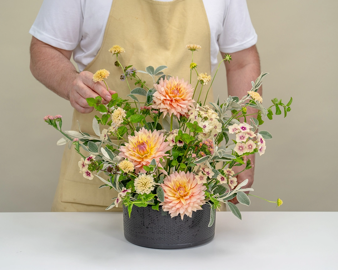 A block of sustainable floristry Phoam, secured to a white dish with compostable string