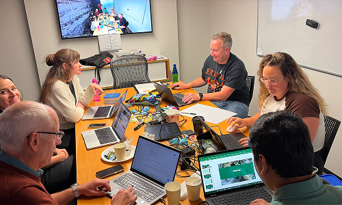 people working around a table