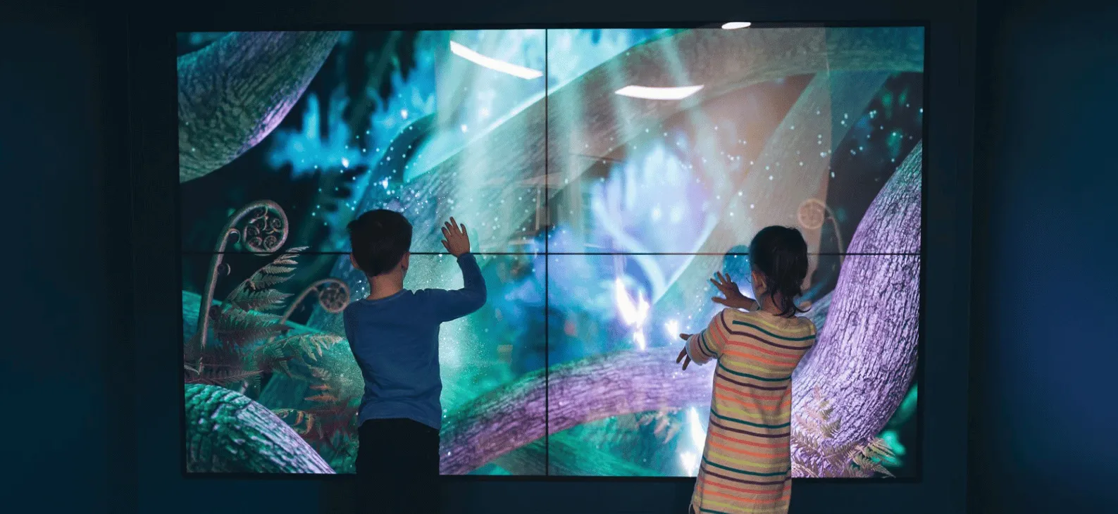 Two children in front of Starship magic forest experience