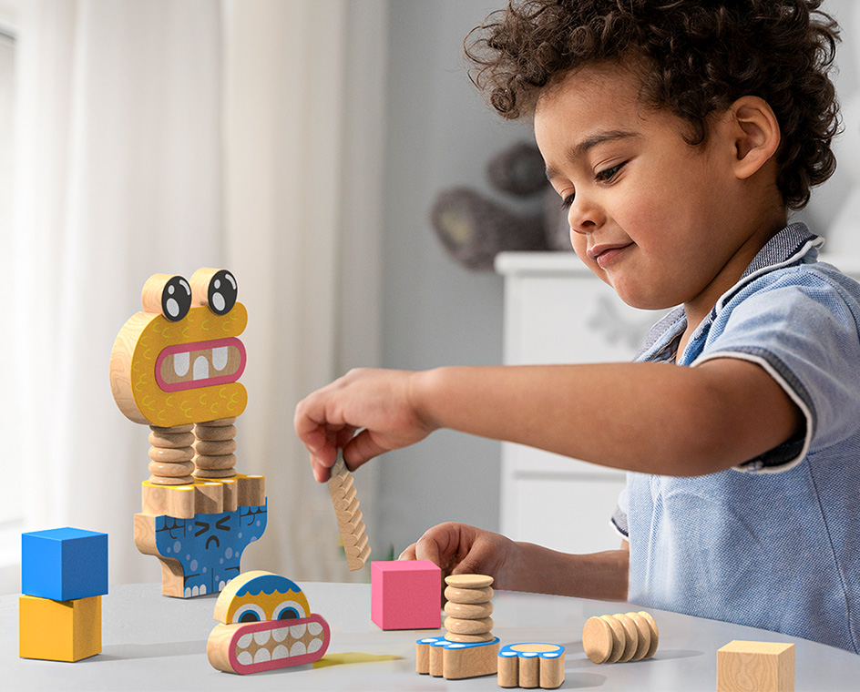 child playing with the wooden block set