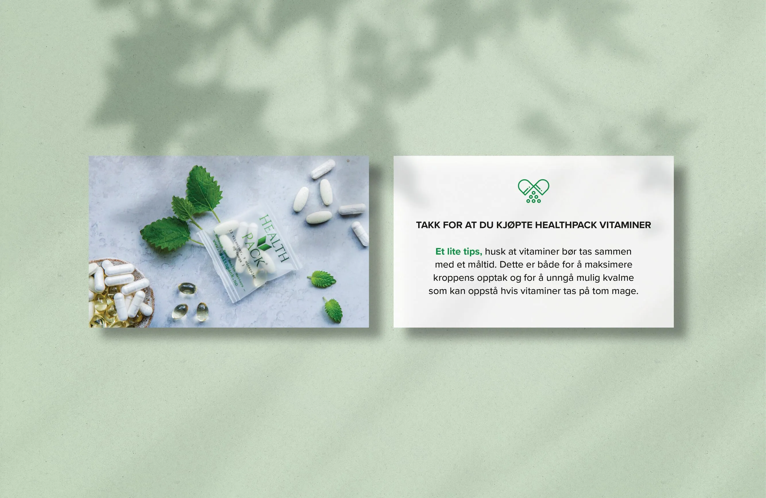 Two cards on a green surface, left card shows HealthPack vitamin capsules and pills with green leaves, right card contains a thank you note with vitamin usage advice in Norwegian.