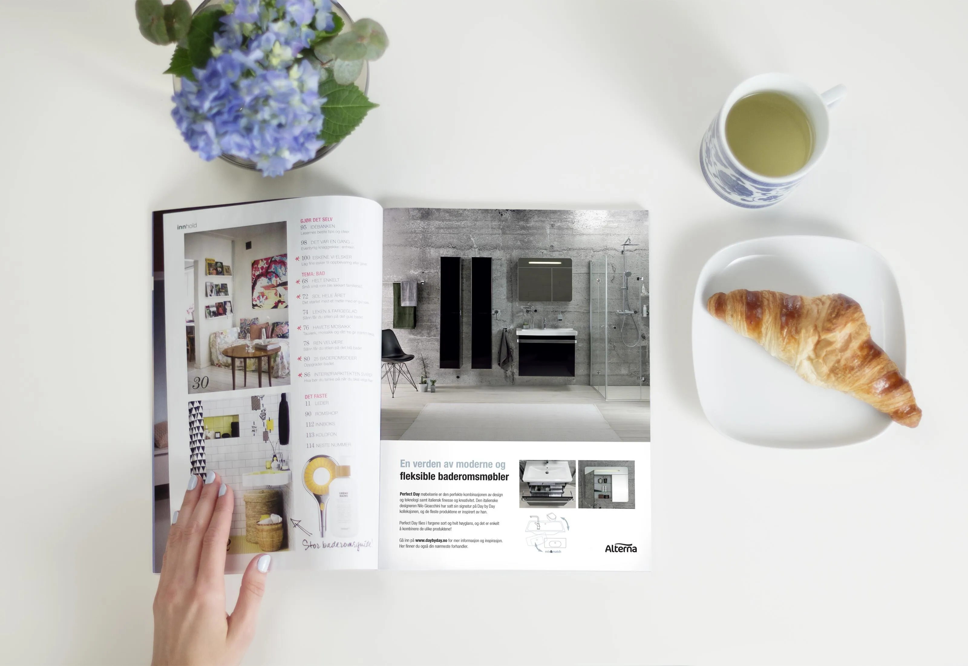 Modern bathroom interior featuring Alterna bathroom furniture with white vanity unit, light oak wood cabinet doors, polished chrome taps, white subway wall tiles, and warm-toned wooden floorboards.