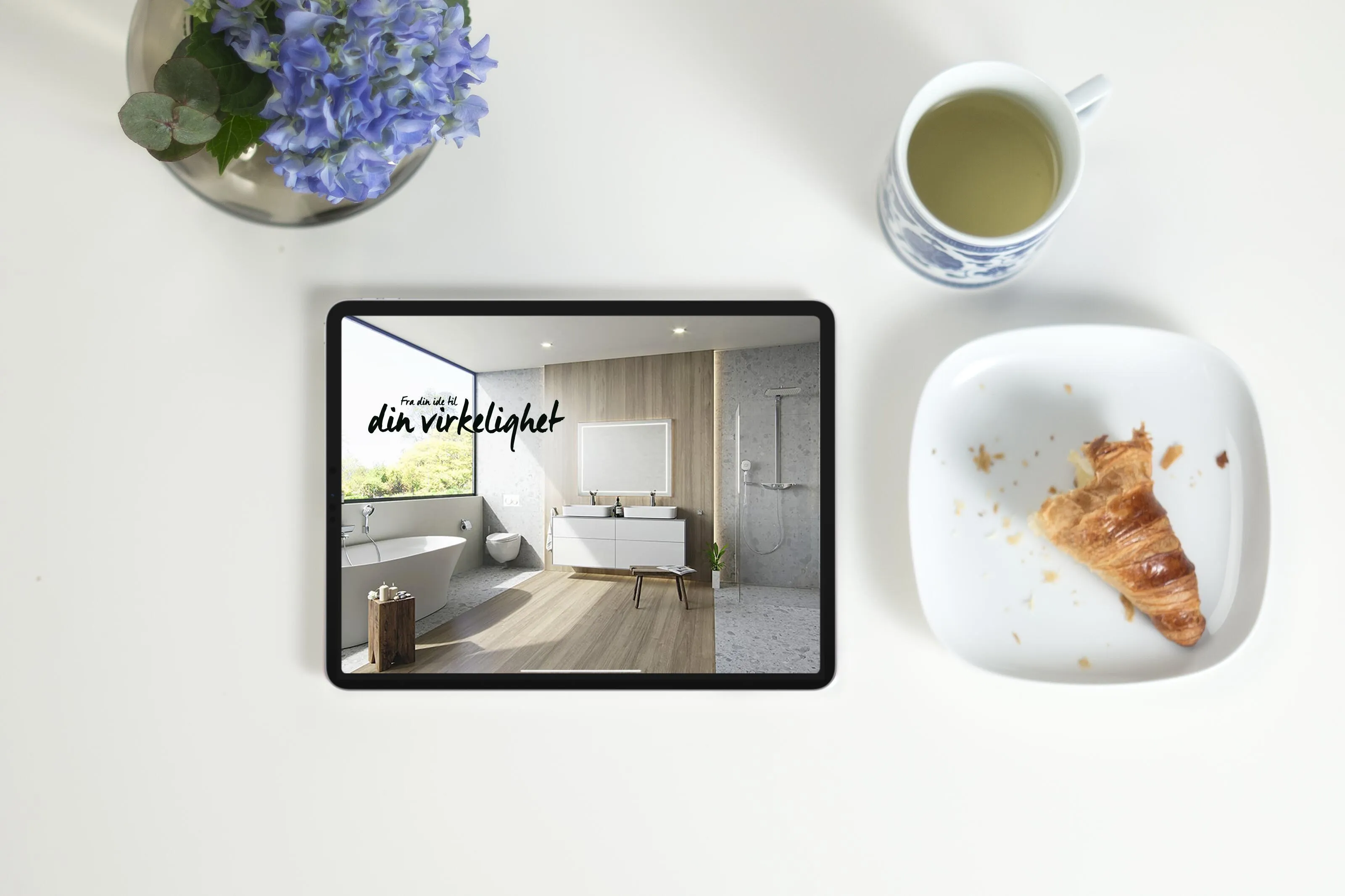 Picture of luxurious Nordic bathroom interior showcasing Alterna bathroom furniture including white freestanding bathtub, black vanity unit with white ceramic sink, illuminated mirror, marble floor tiles, and hanging green plant creating spa-like ambience on an ipad.