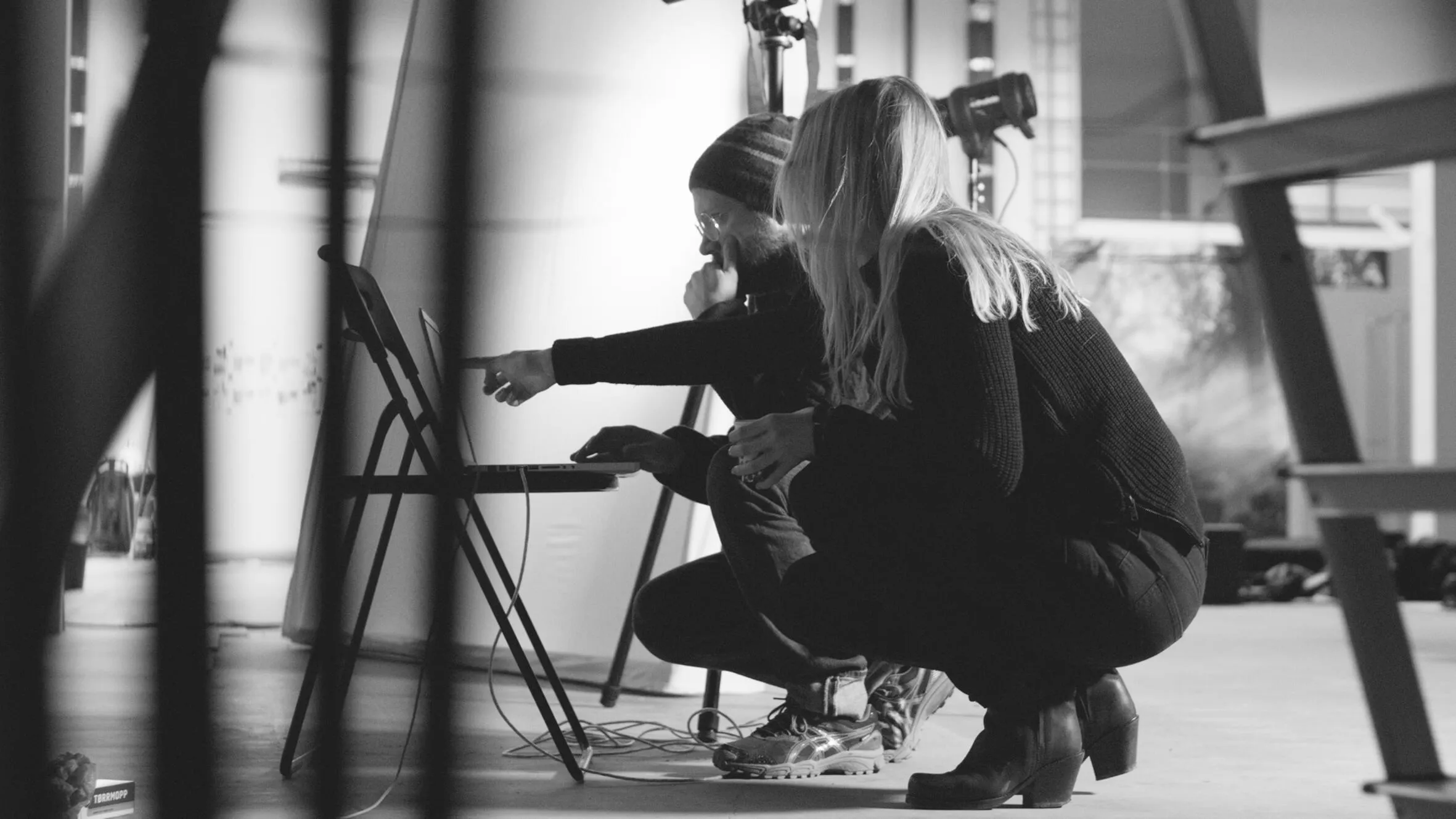 Close-up detail of Alterna bathroom cabinet showing light oak wood grain texture, polished chrome handle, and white ceramic undermount sink basin with chrome mixer tap.