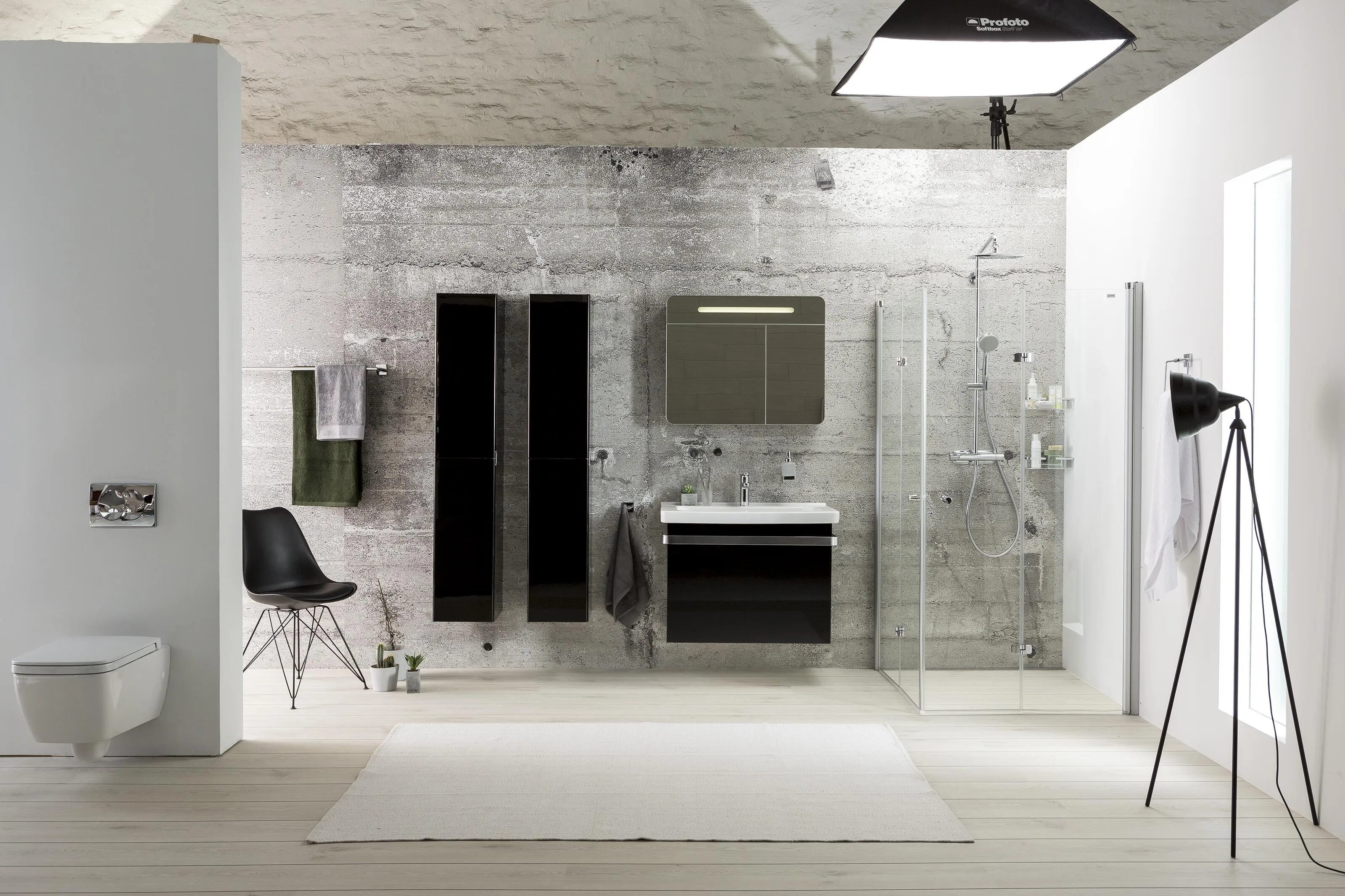 Professional photography studio setup with lighting equipment, camera tripod, backdrop reflectors, and studio lighting demonstrating the production process for Alterna product photography.