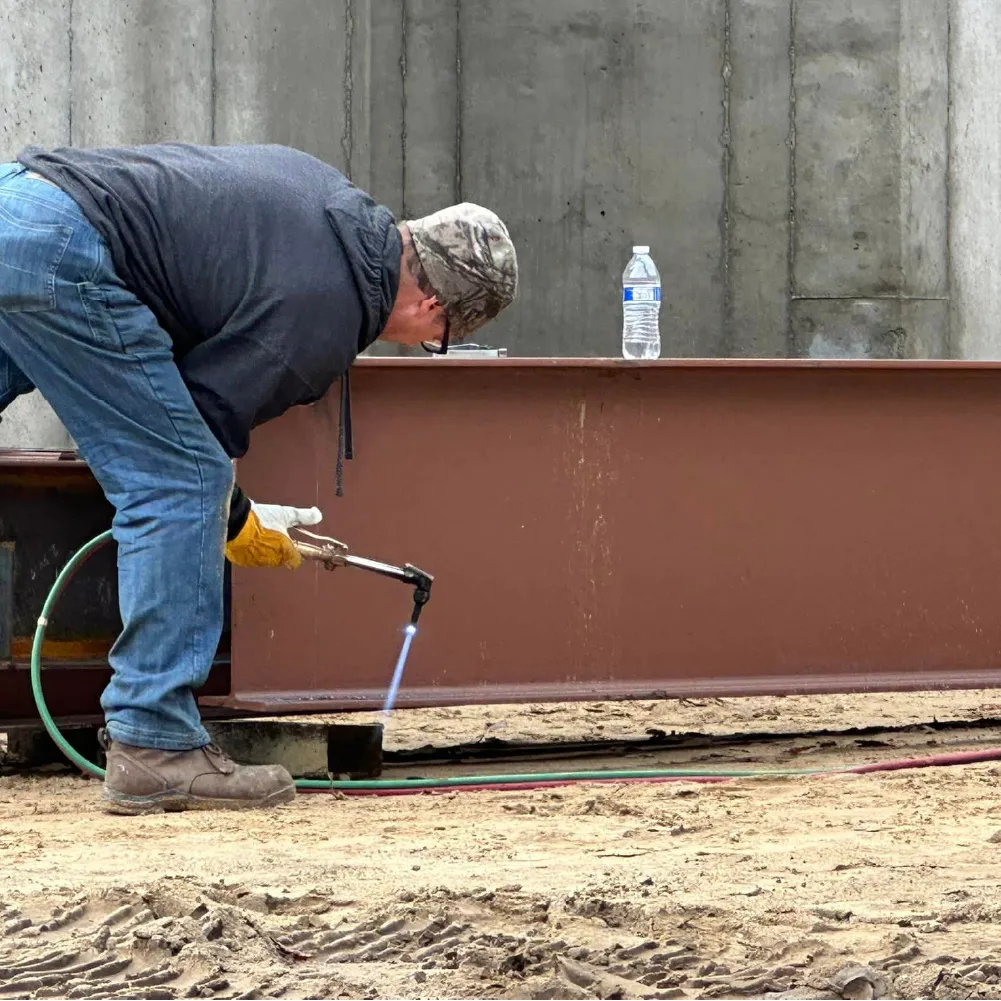Blox employee welding shipping container
