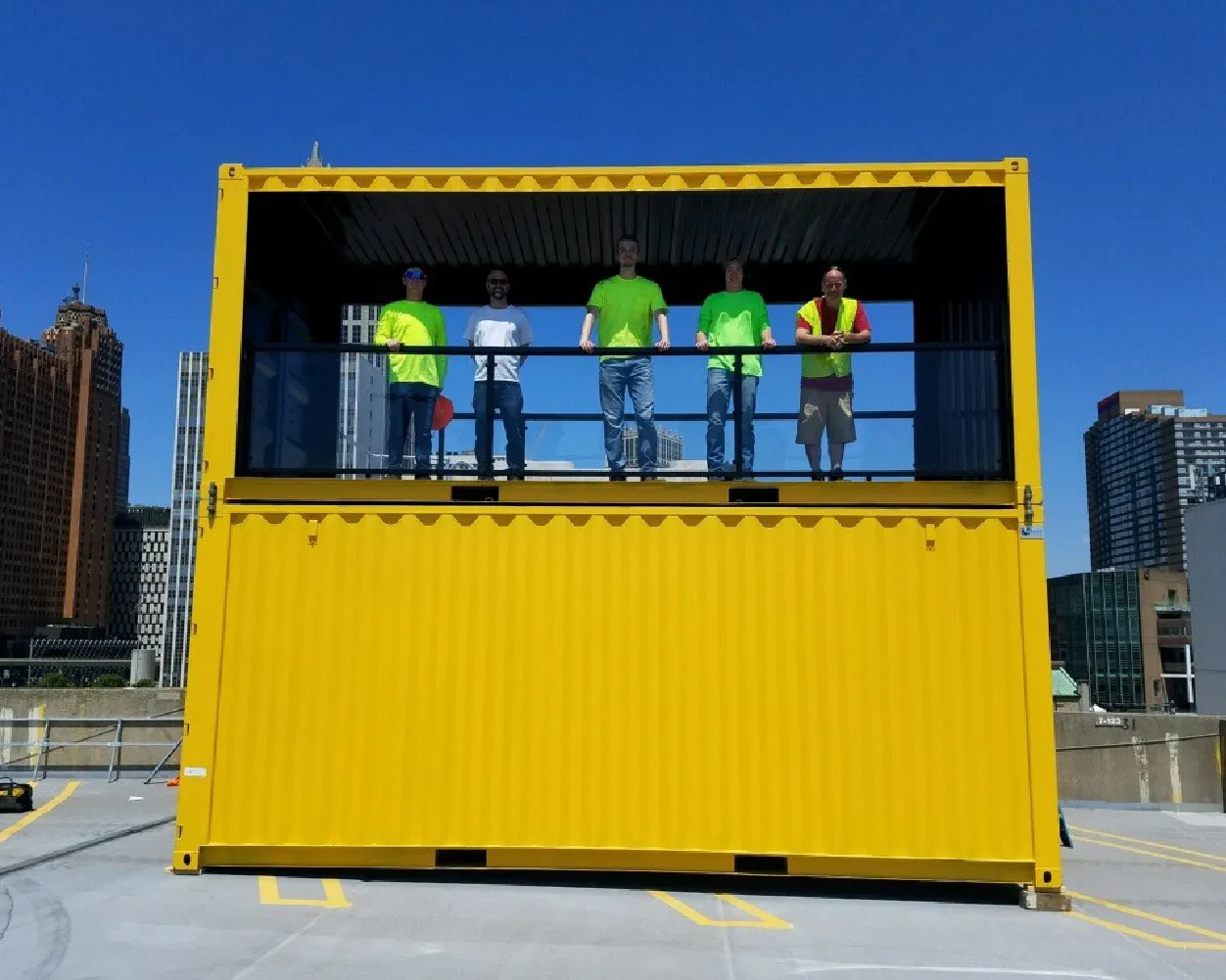 Blox employees on top deck of shipping container