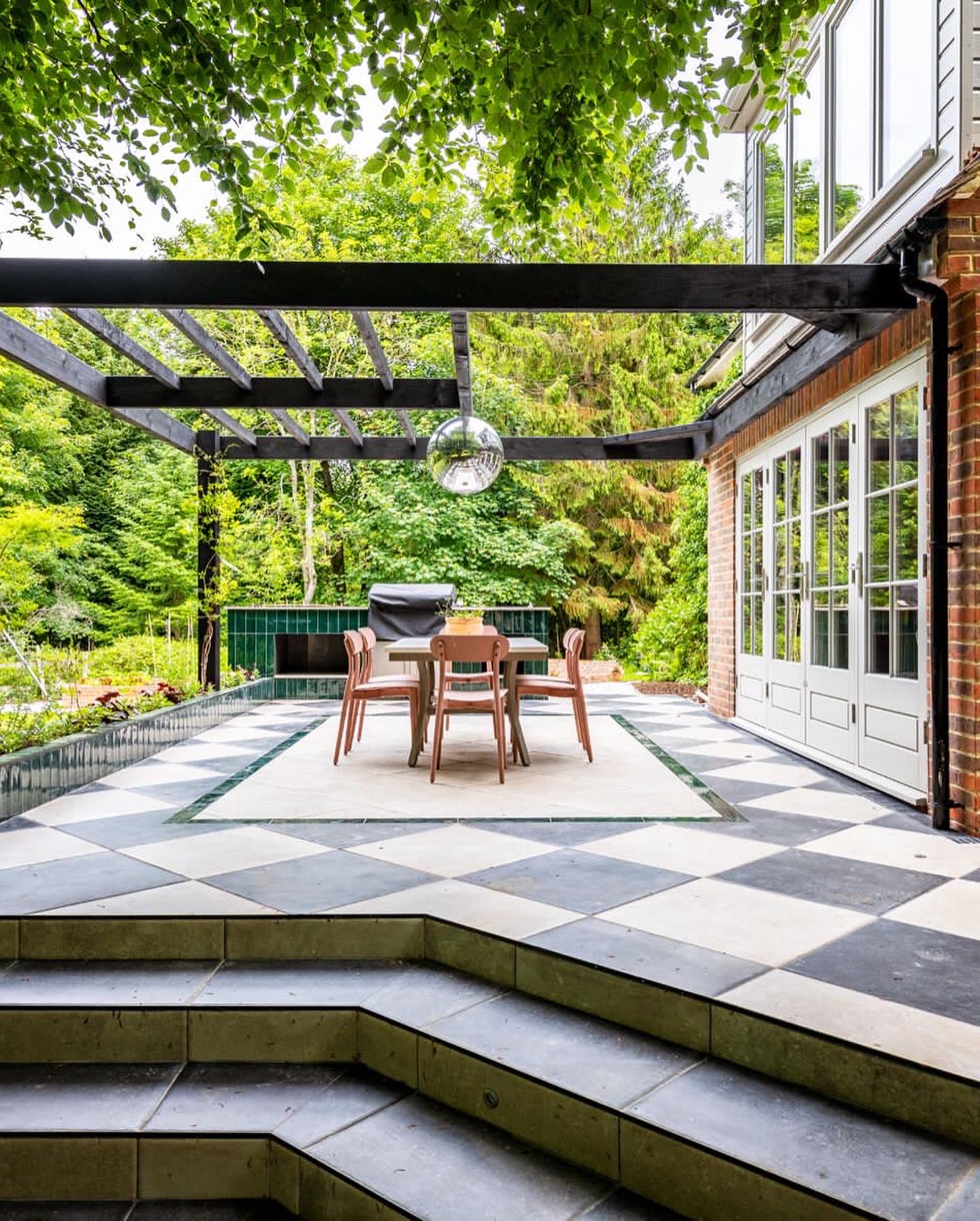 Wildlife-friendly planting borders in Kent country garden with perennials