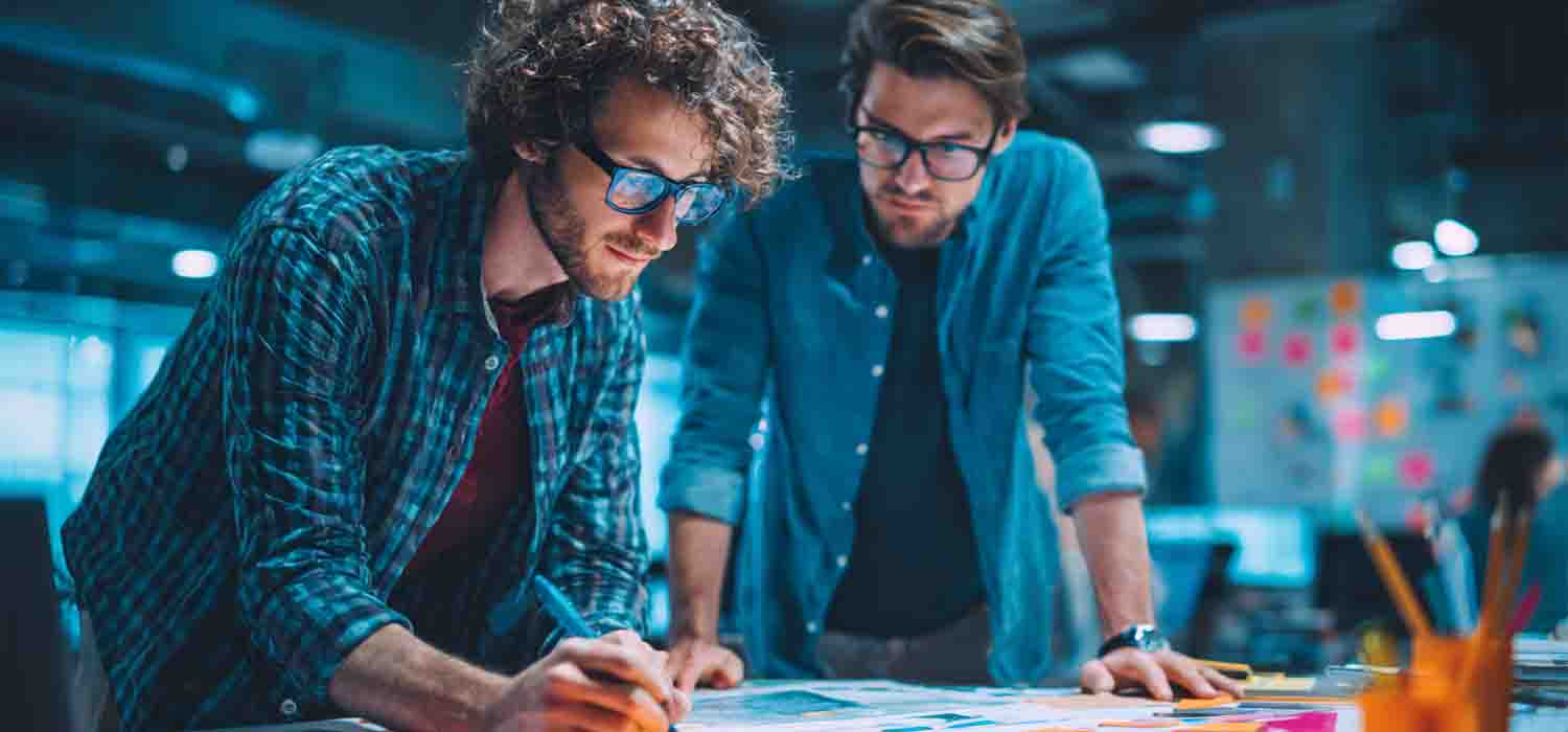Marketing specialists developing a lead generation plan for a tech business