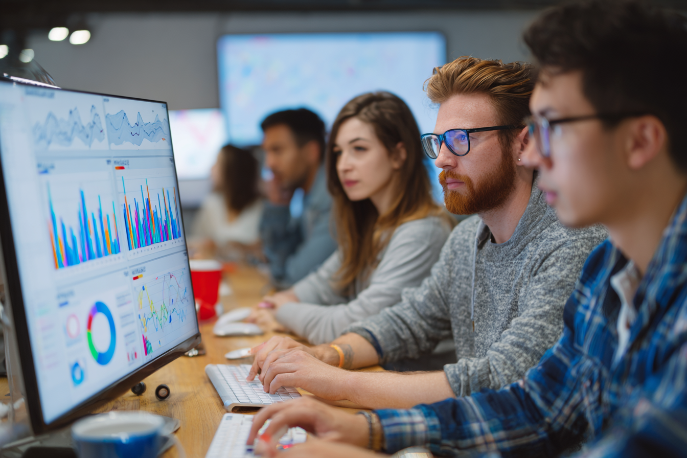 SEO team analyzing keyword reports and search engine results.