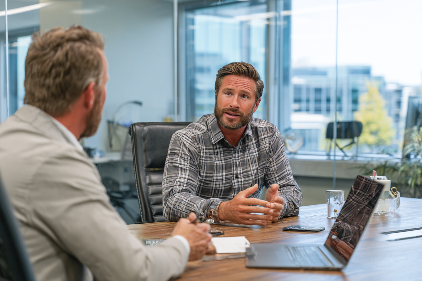 MSP consultant discussing service options with a client in a meeting room