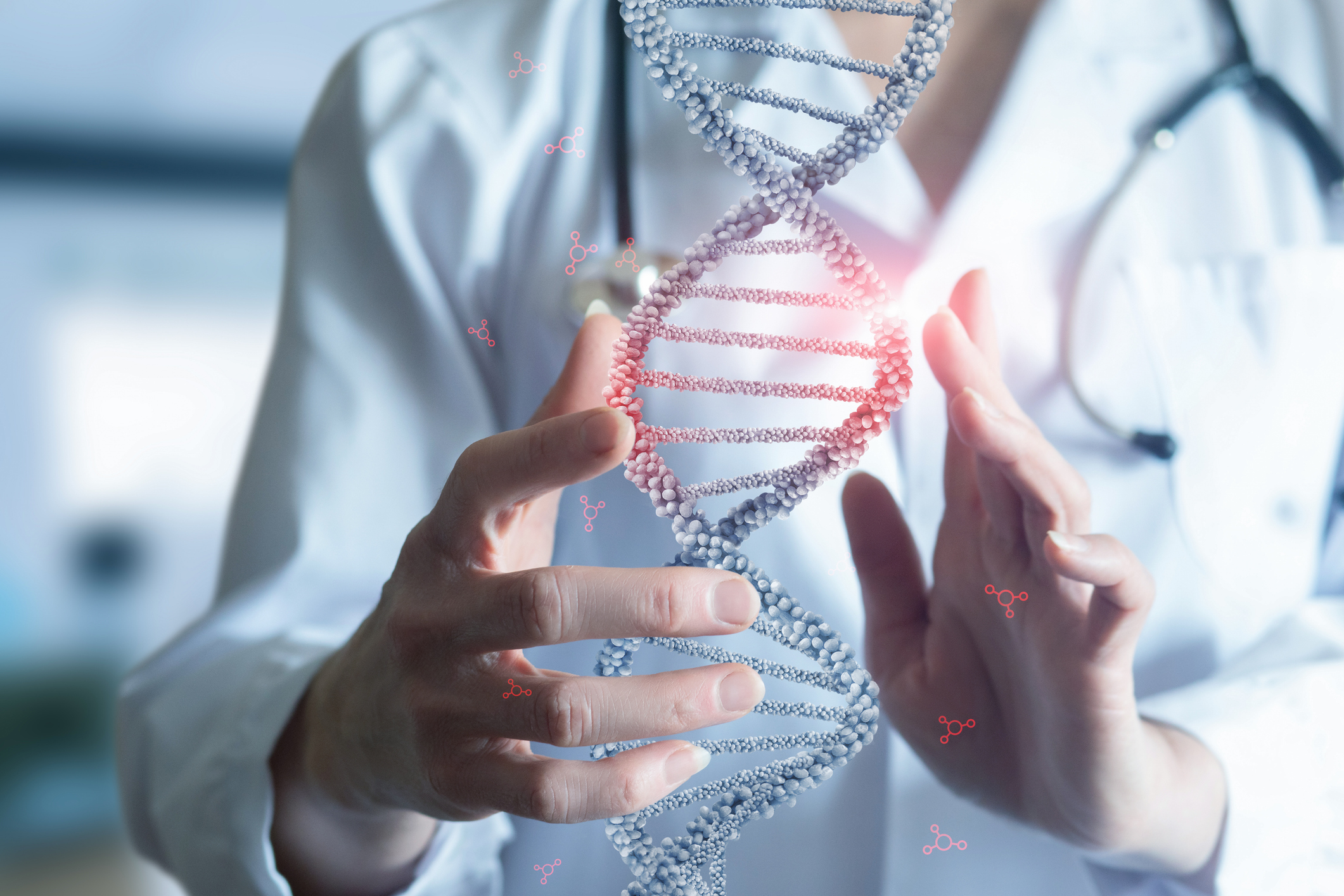 Hands framing an illustration of a DNA double helix